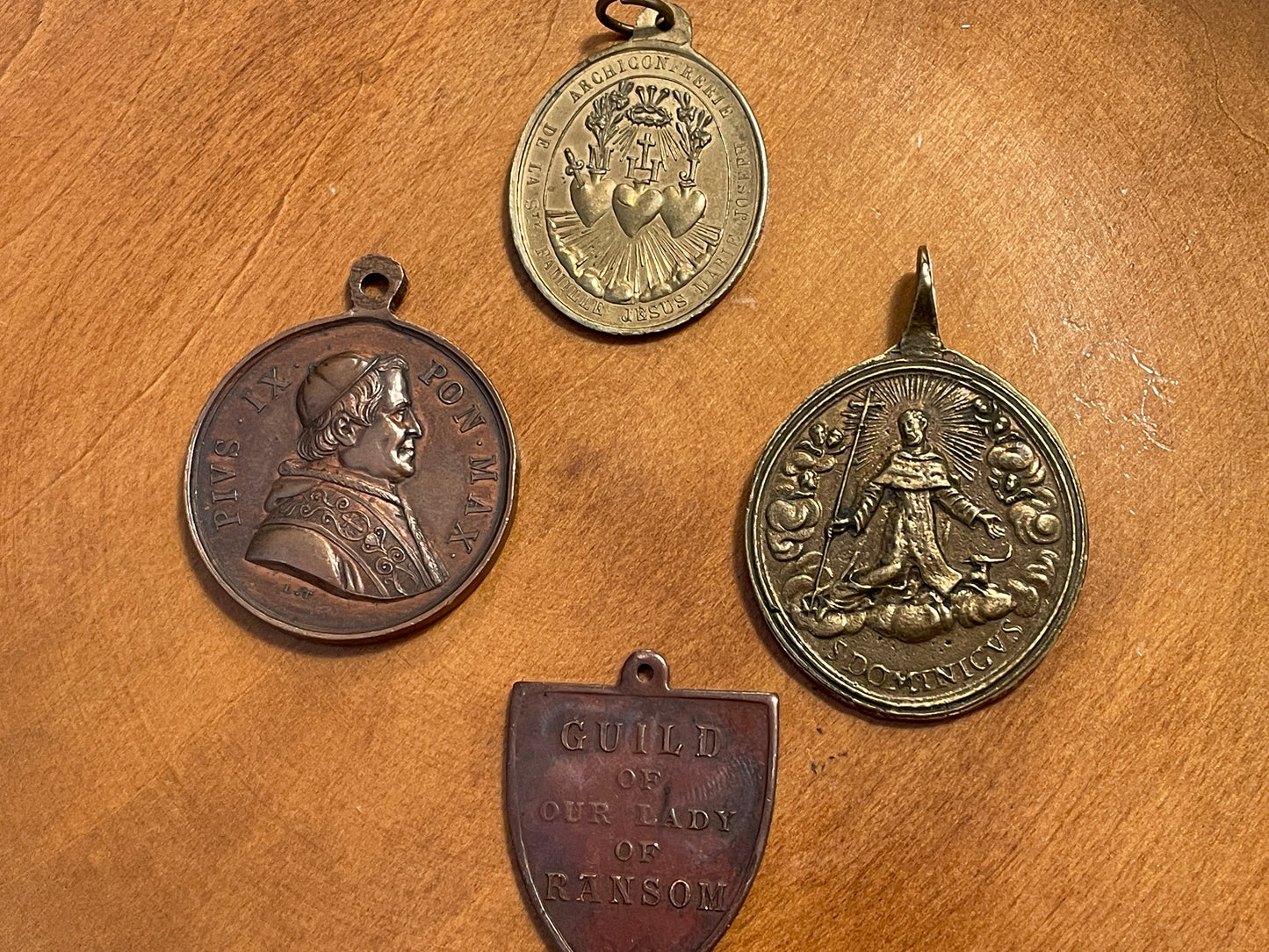 Set of Four Antique Catholic Medals – Pius IX, Our Lady of Ransom, Sacred Heart & Our Lady of Mount Carmel, c.1870–1920