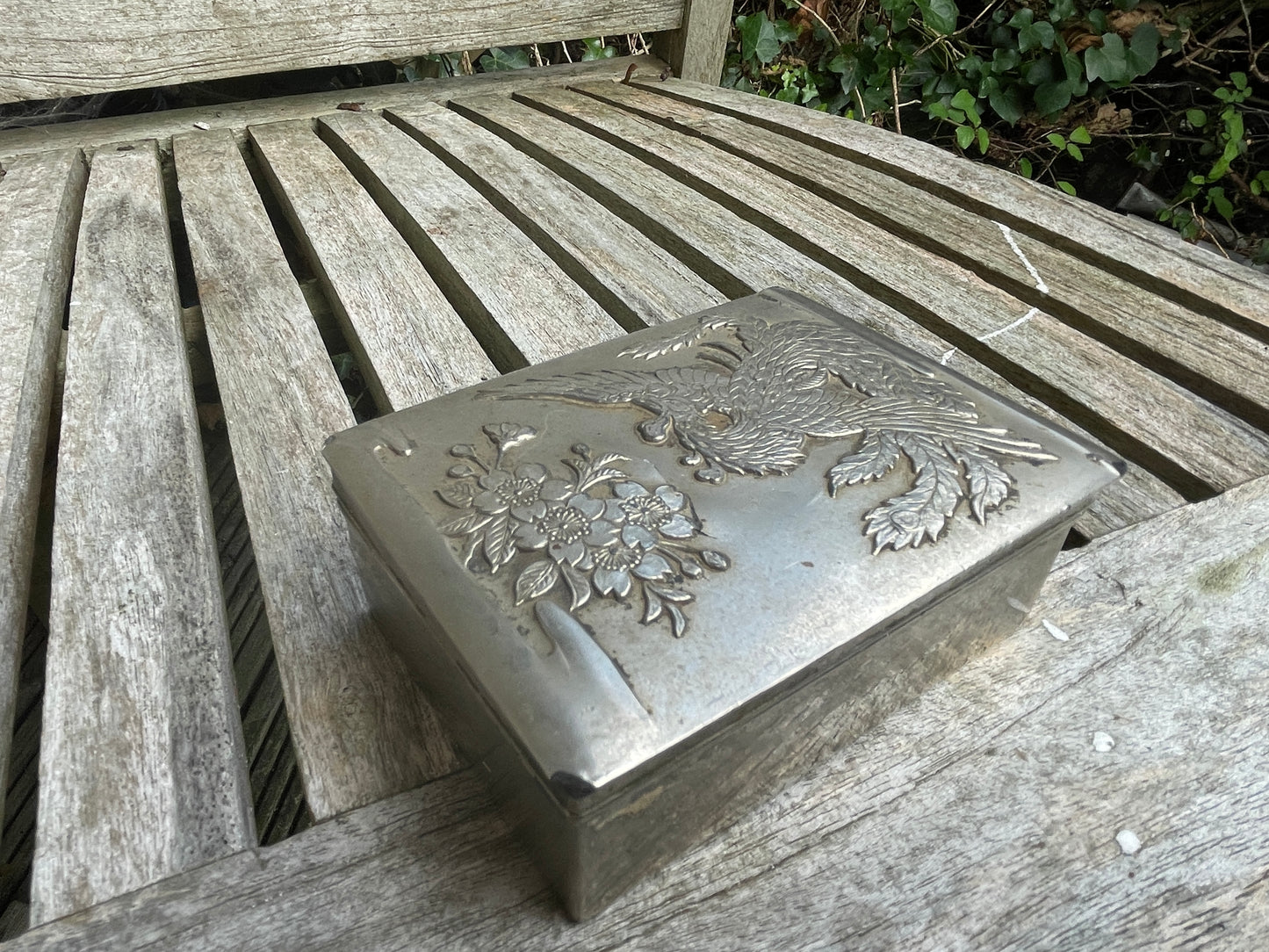 Vintage white metal trinket box with dragon and foliage design