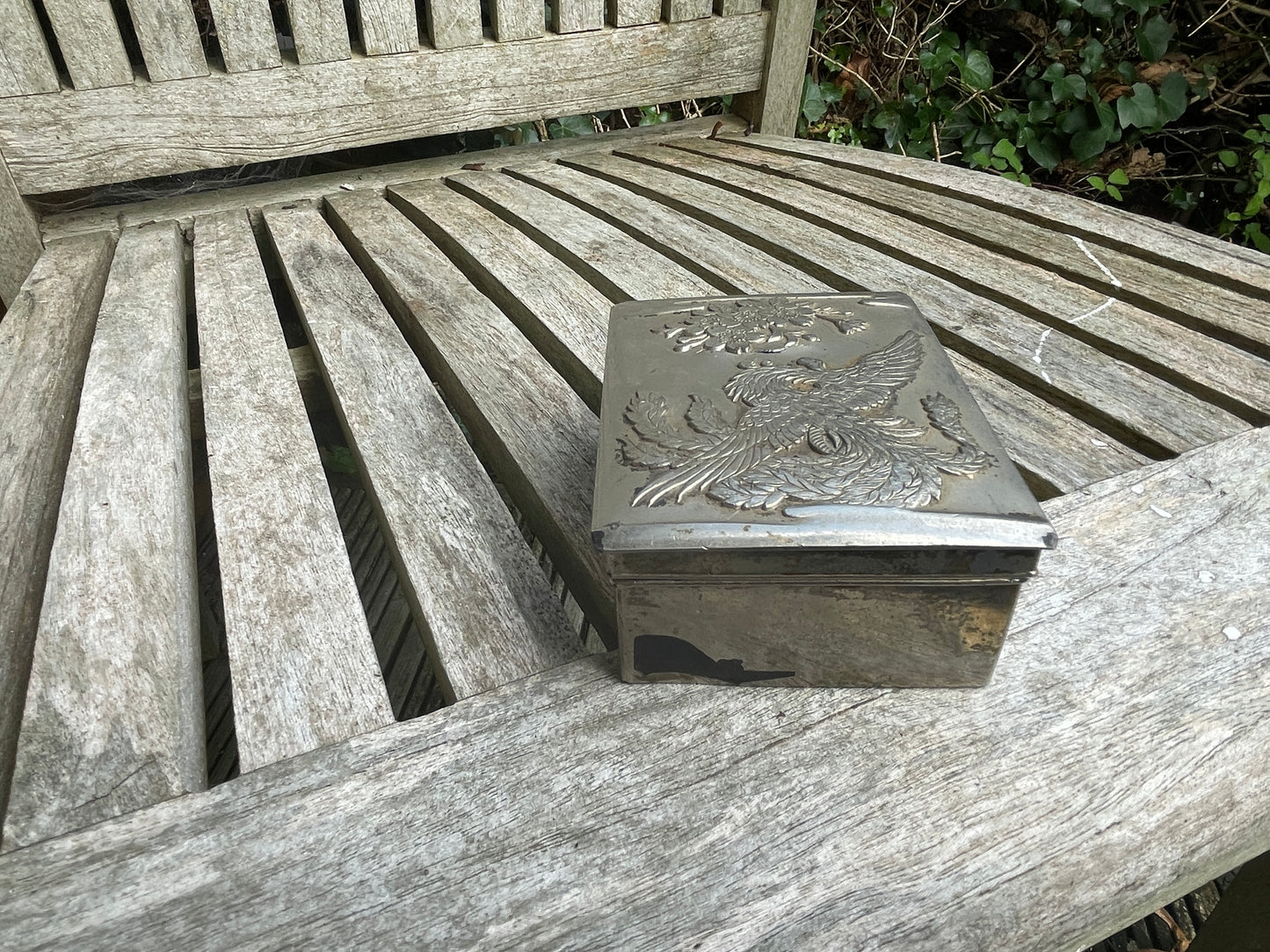 Vintage white metal trinket box with dragon and foliage design