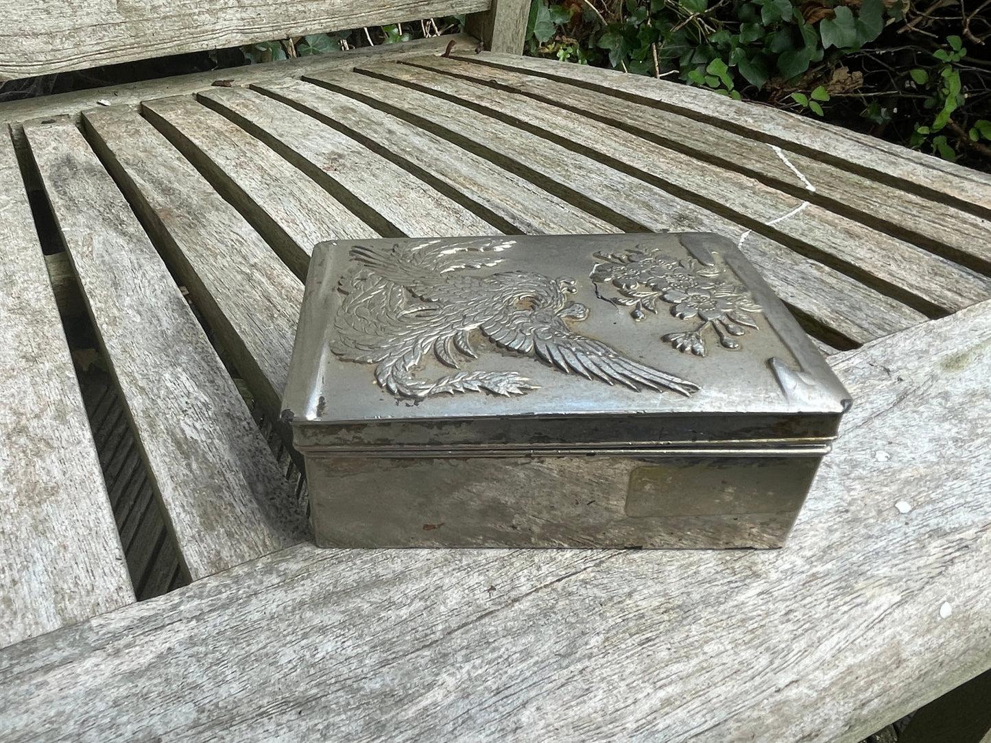 Vintage white metal trinket box with dragon and foliage design