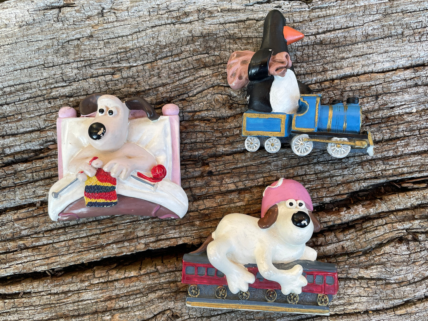 Three ceramic Wallace and Gromit vintage fridge magnets starring Feathers McGraw c1995