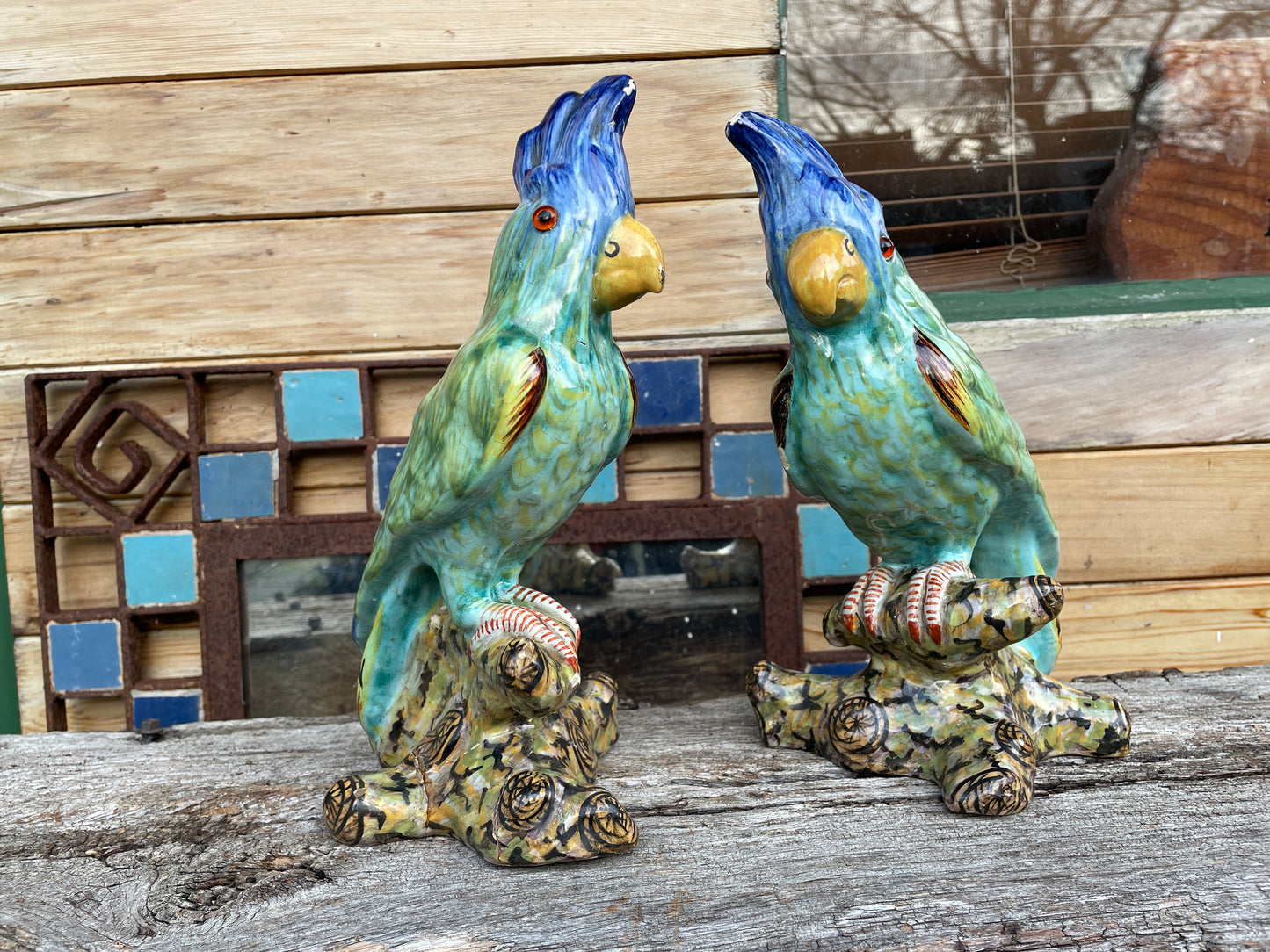 Pair of antique continental faience signed ceramic parakeets 26cm tall