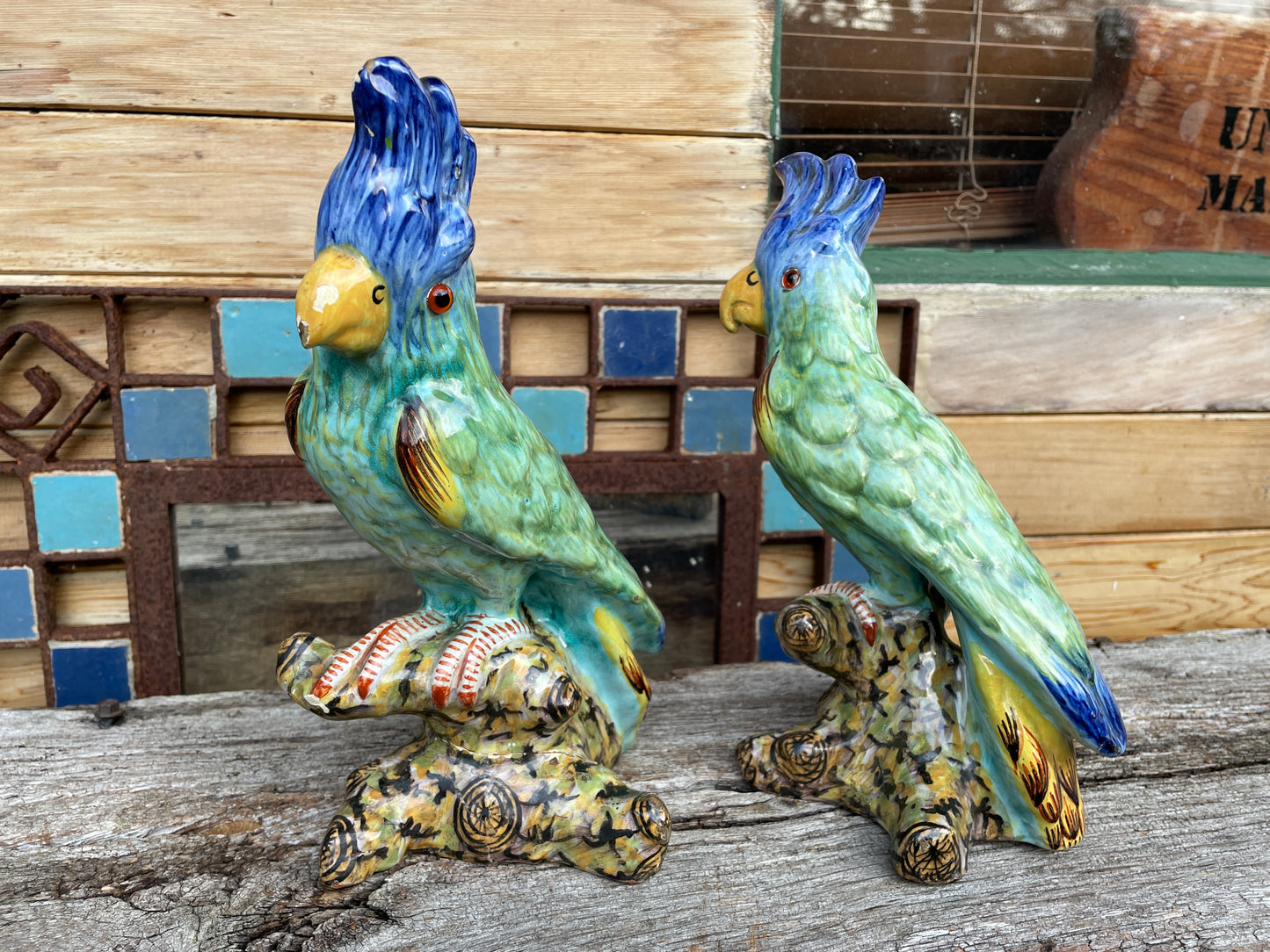 Pair of antique continental faience signed ceramic parakeets 26cm tall