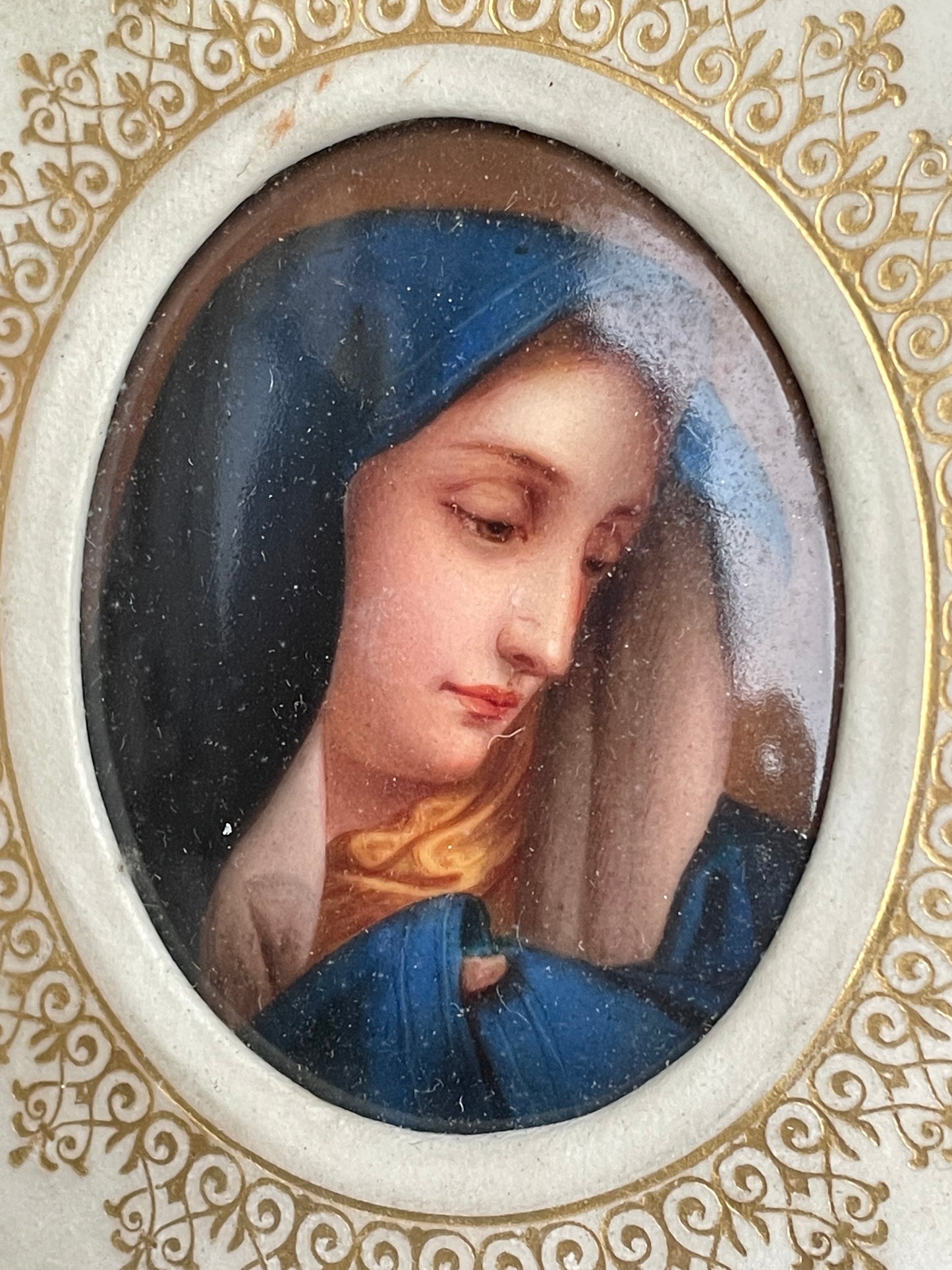 Antique watercolour miniature on ceramic cushion frame surround mounted in a giltwood and gesso decorated frame