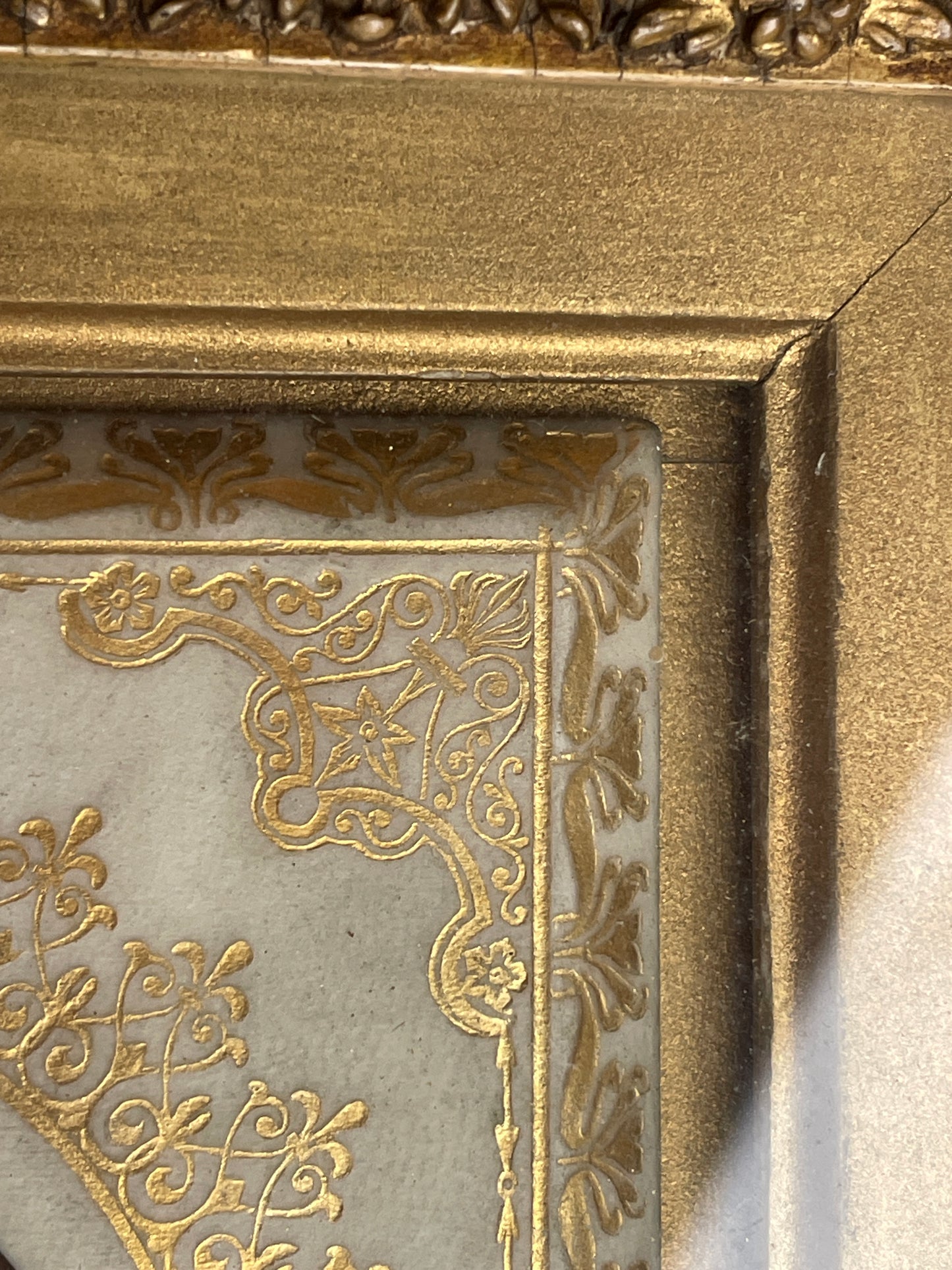 Antique watercolour miniature on ceramic cushion frame surround mounted in a giltwood and gesso decorated frame