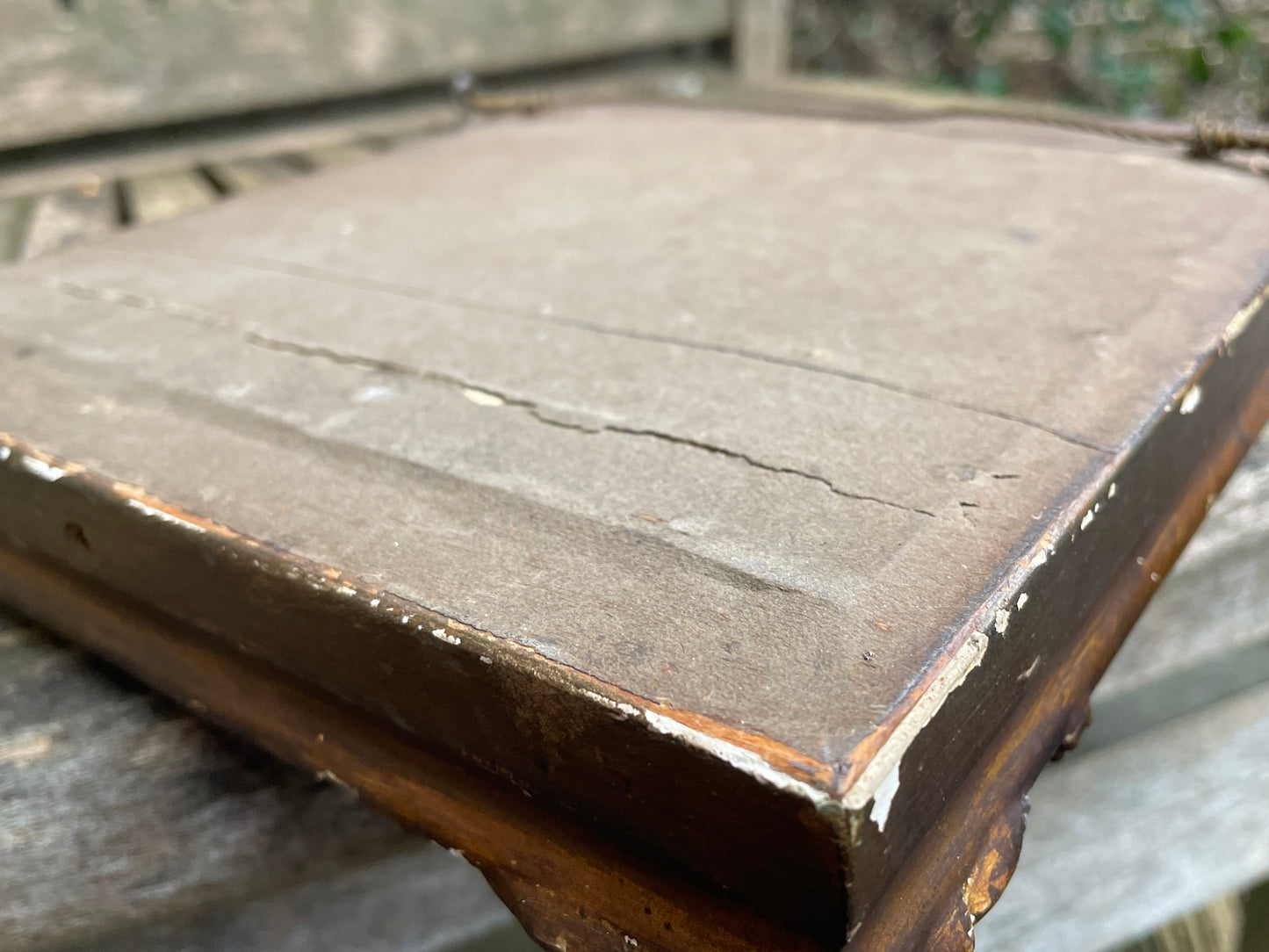 Antique watercolour miniature on ceramic cushion frame surround mounted in a giltwood and gesso decorated frame