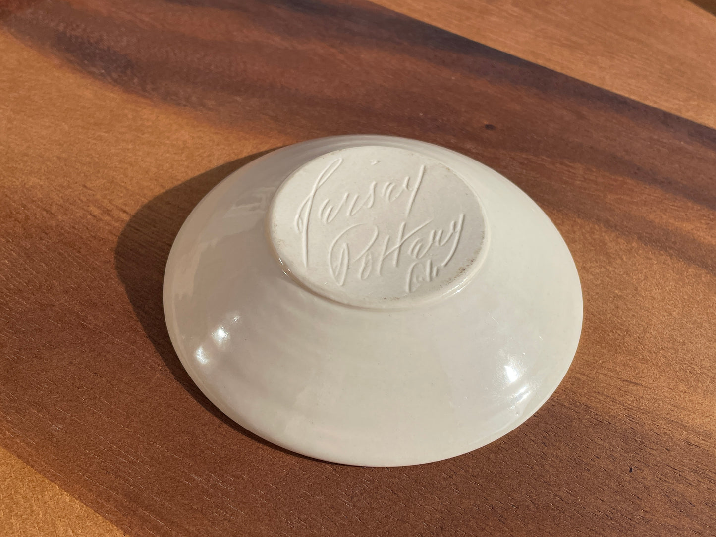 Jersey Pottery shallow dish with Sgraffito fish design in black and white 10.5cm diameter c1965