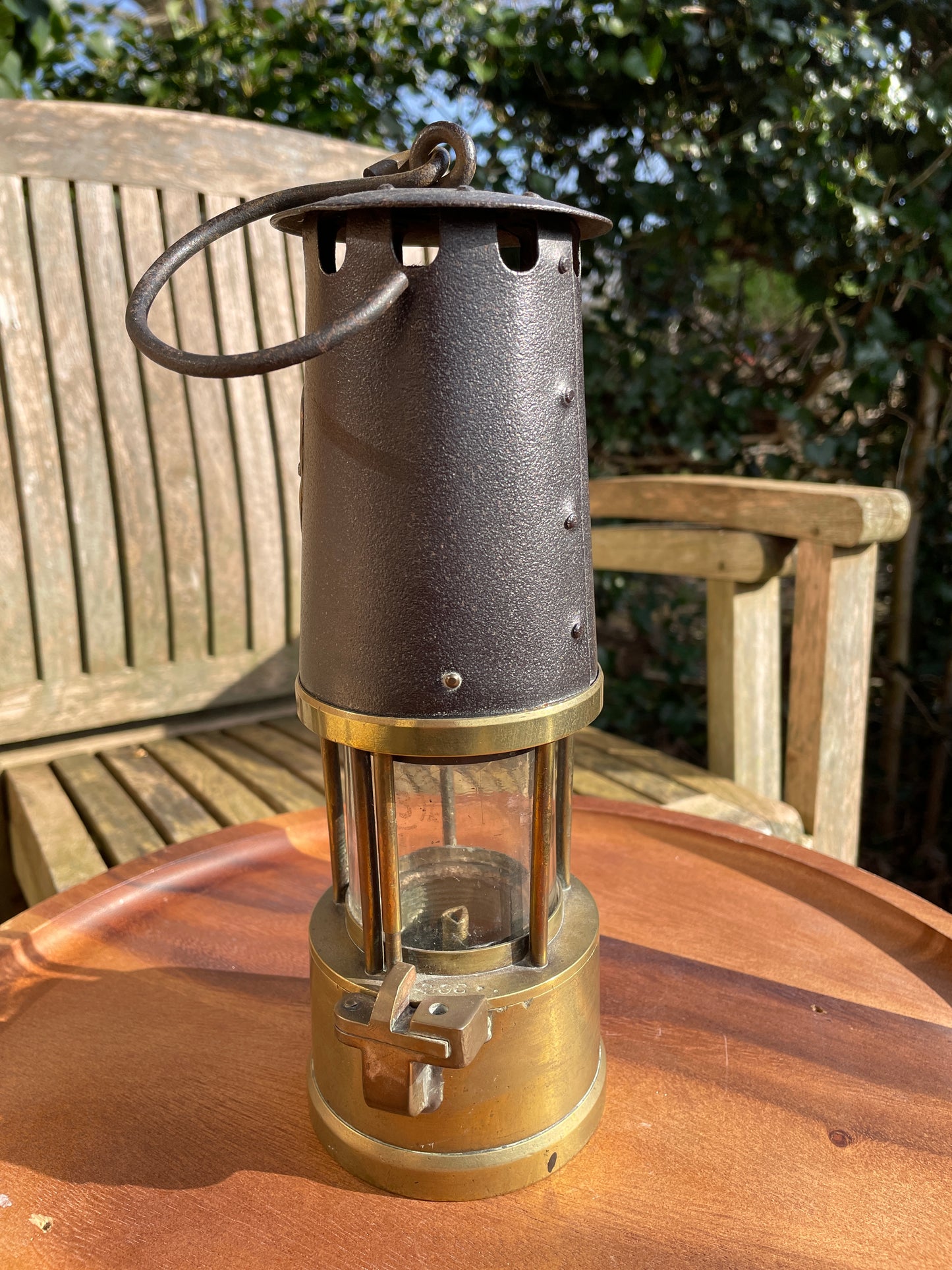 Antique brass miners lamp called The Protector lamp and lighting Co of Eccles Manchester