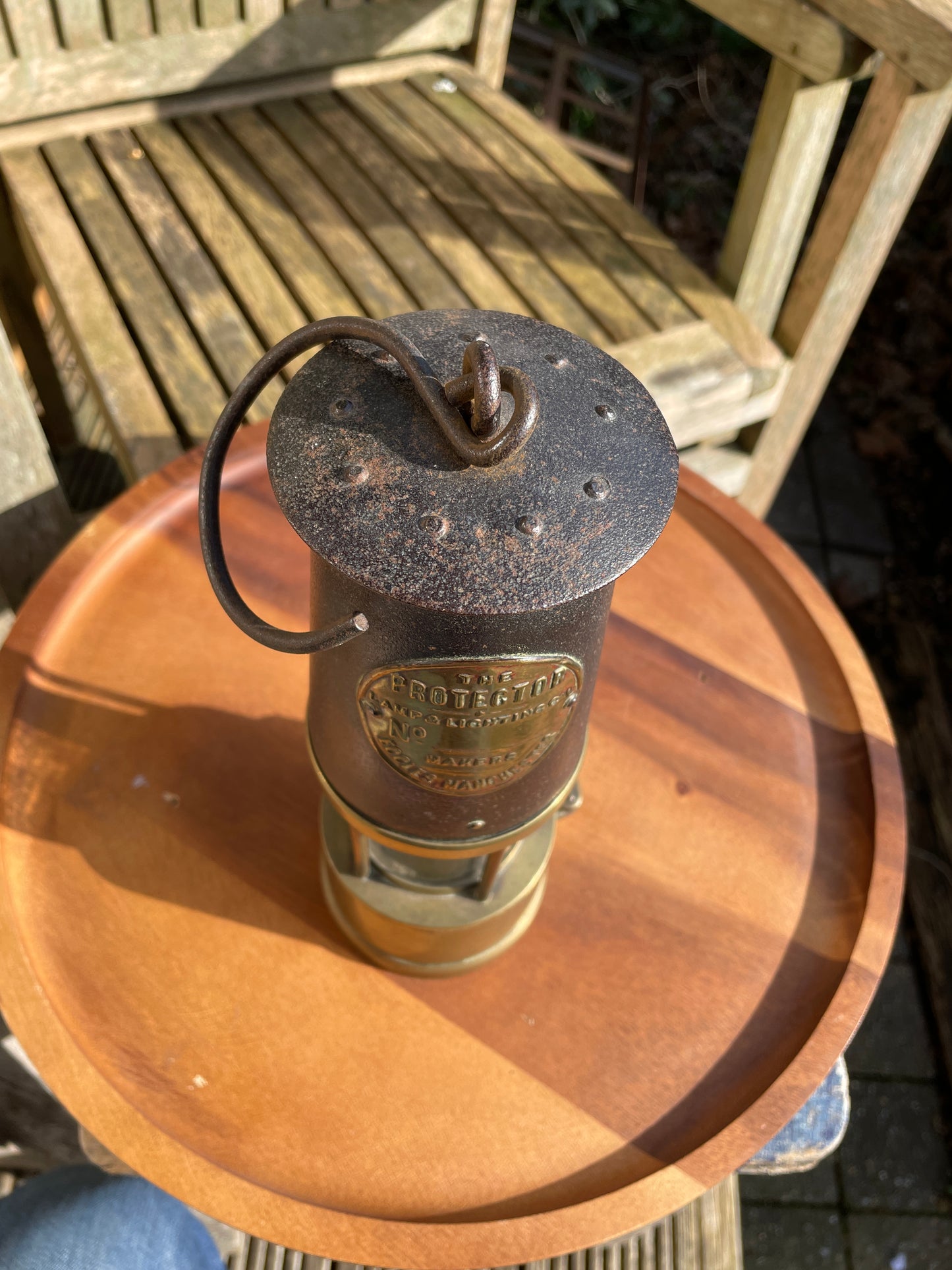Antique brass miners lamp called The Protector lamp and lighting Co of Eccles Manchester