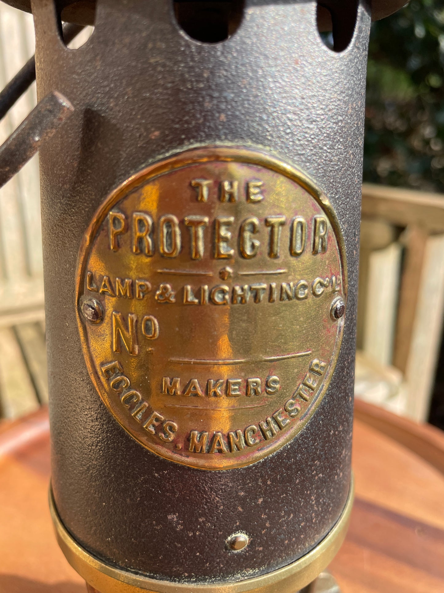 Antique brass miners lamp called The Protector lamp and lighting Co of Eccles Manchester
