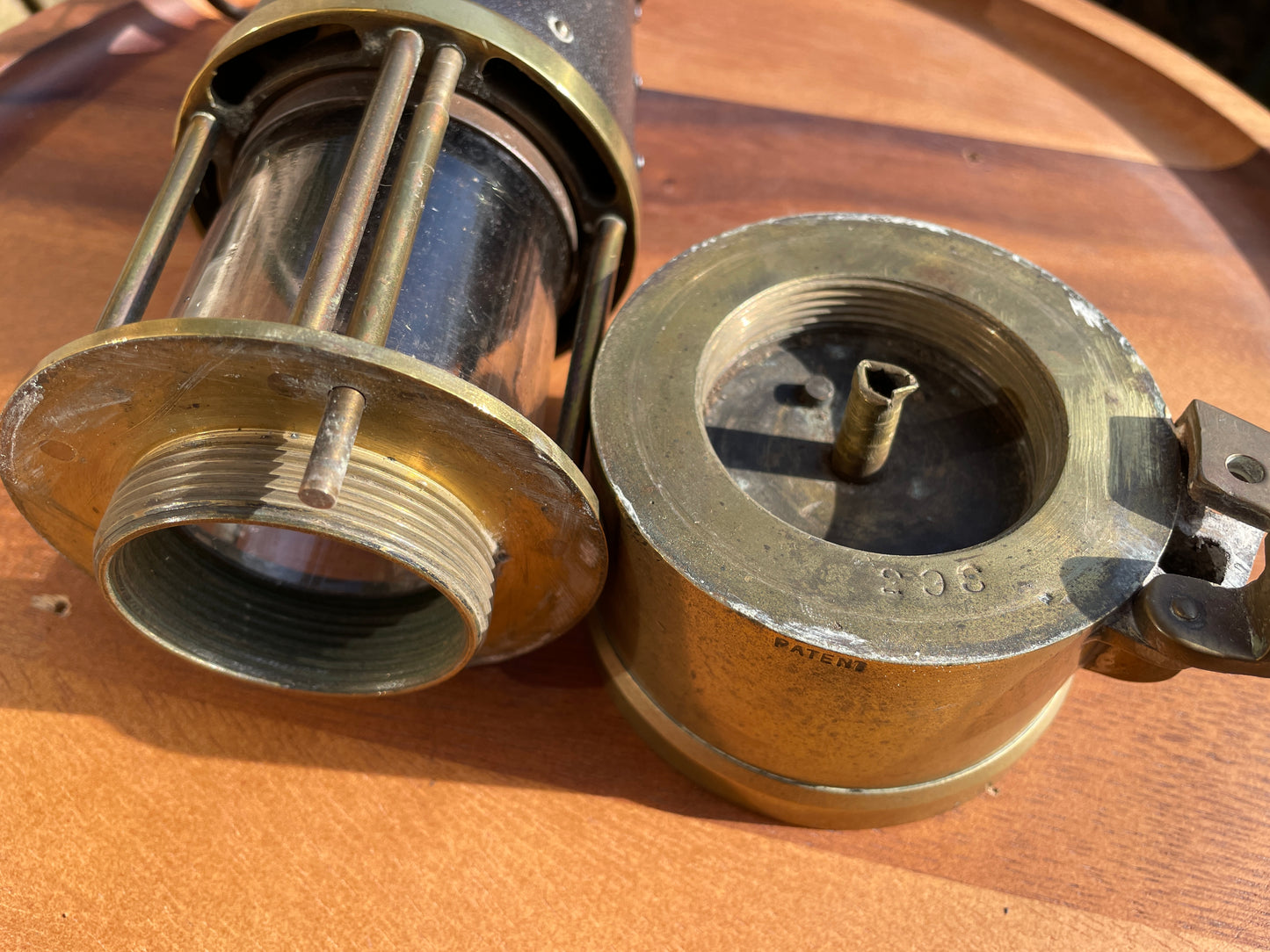 Antique brass miners lamp called The Protector lamp and lighting Co of Eccles Manchester