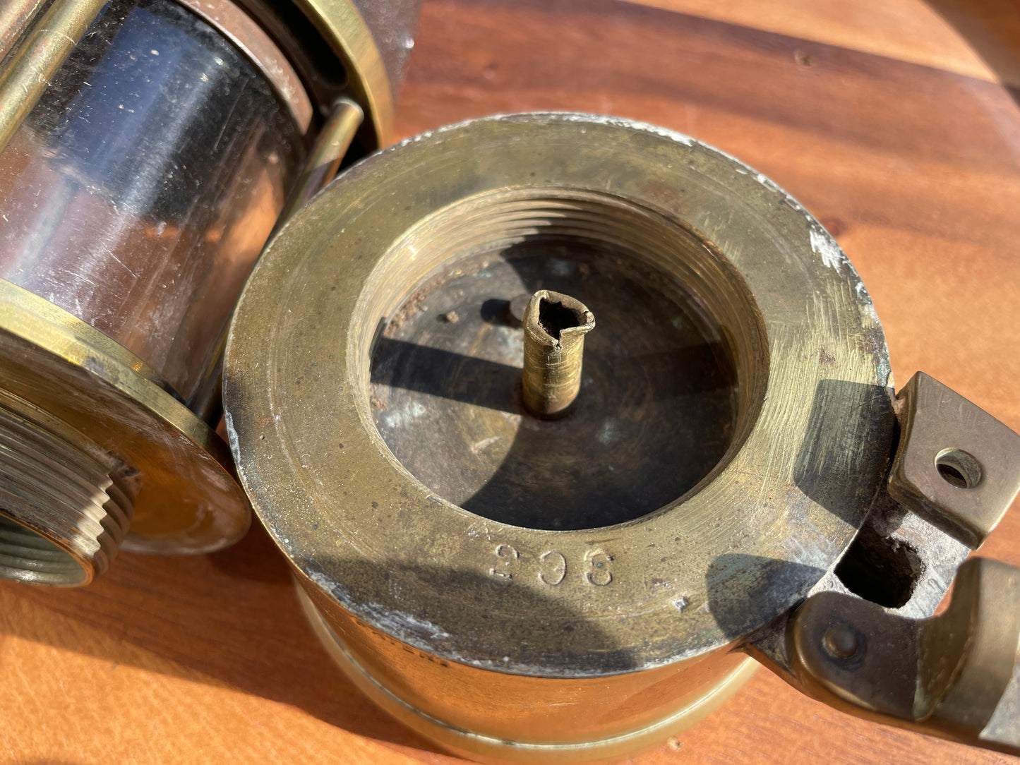 Antique brass miners lamp called The Protector lamp and lighting Co of Eccles Manchester