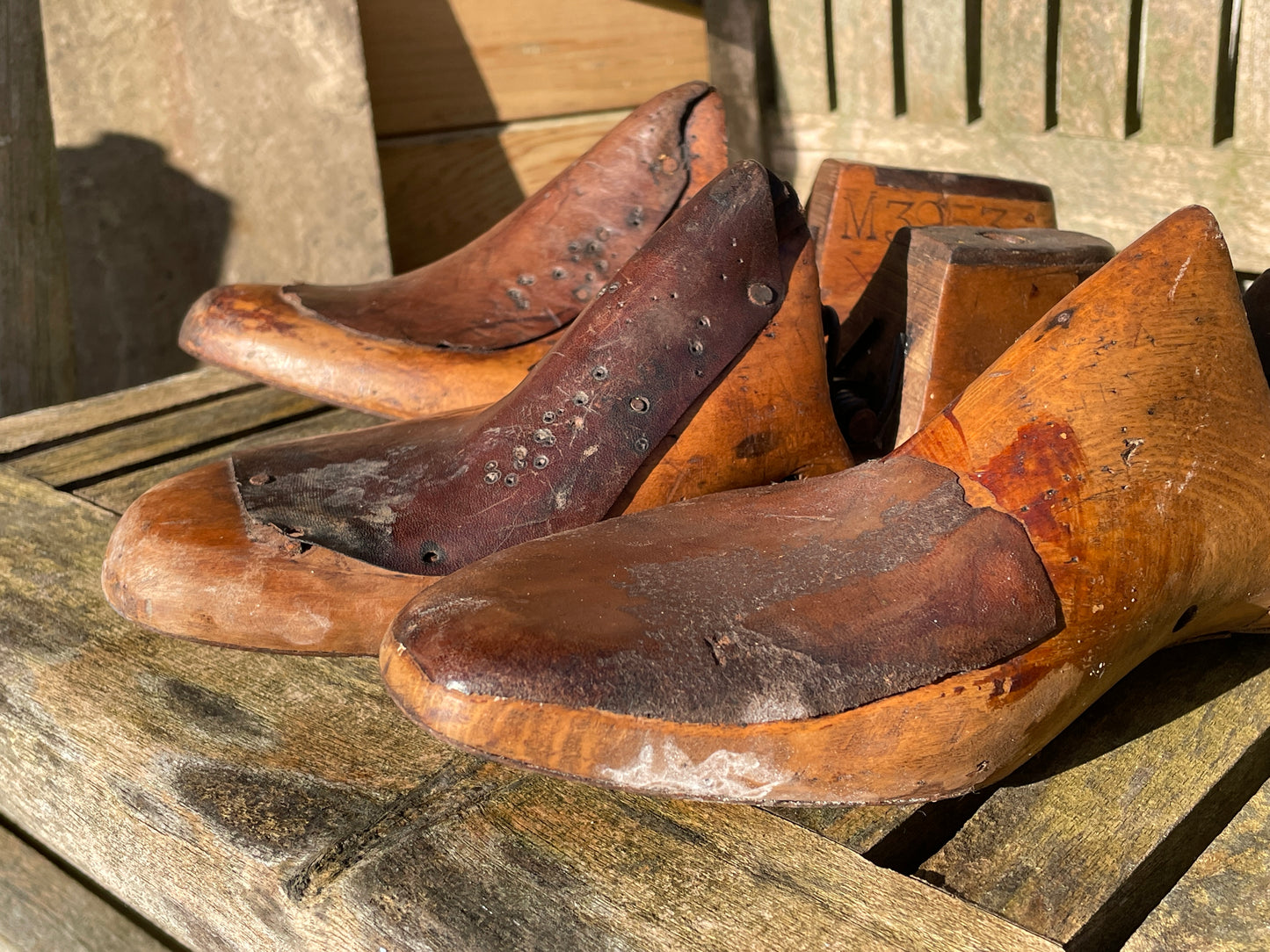 Antique Cobbler's wooden shoe lasts or formers with original leather patches and metal soles