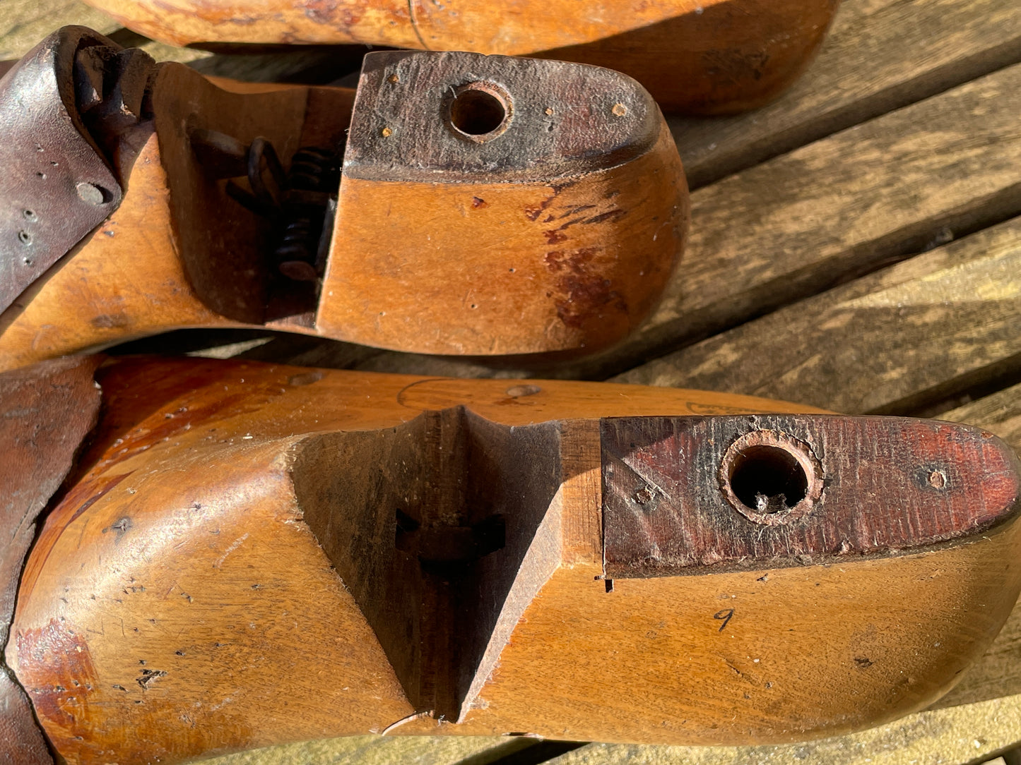 Antique Cobbler's wooden shoe lasts or formers with original leather patches and metal soles