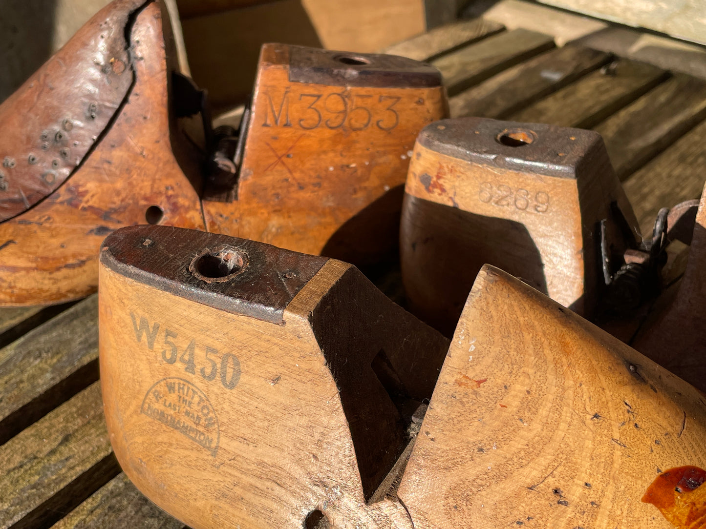 Antique Cobbler's wooden shoe lasts or formers with original leather patches and metal soles