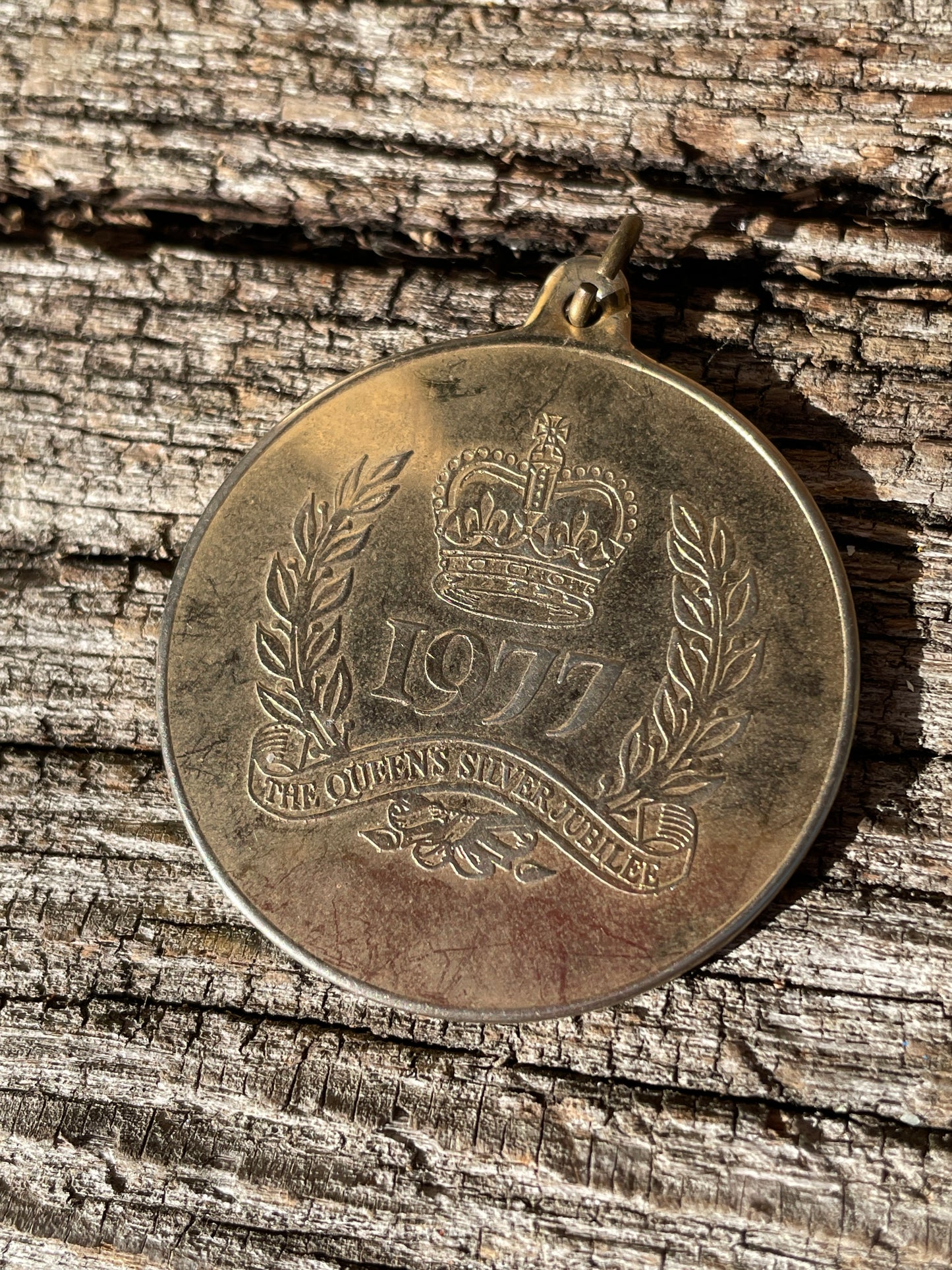 1977 QE II Silver Jubilee Medallion and an ingot pendant both children's seventies jewellery