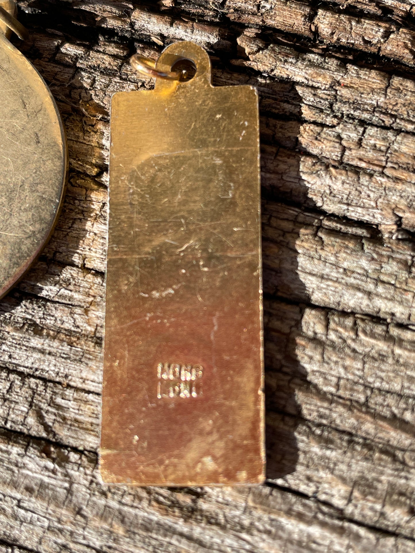 1977 QE II Silver Jubilee Medallion and an ingot pendant both children's seventies jewellery