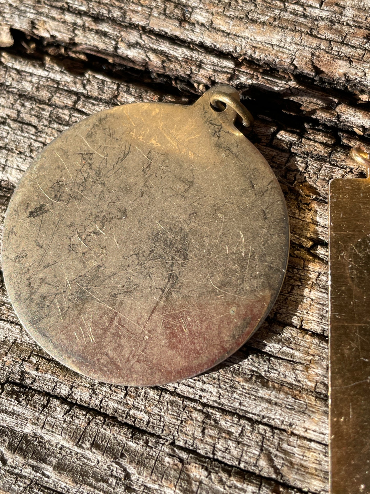 1977 QE II Silver Jubilee Medallion and an ingot pendant both children's seventies jewellery