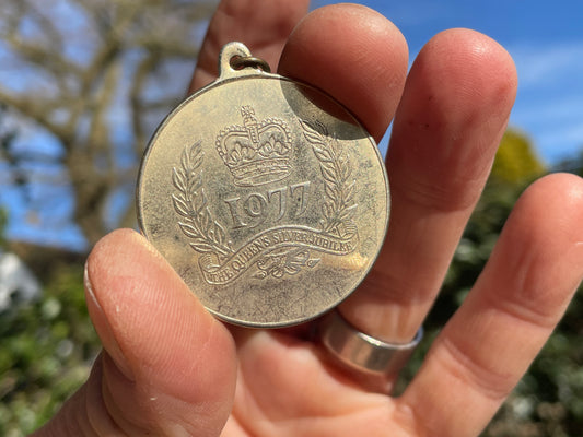 1977 QE II Silver Jubilee Medallion and an ingot pendant both children's seventies jewellery