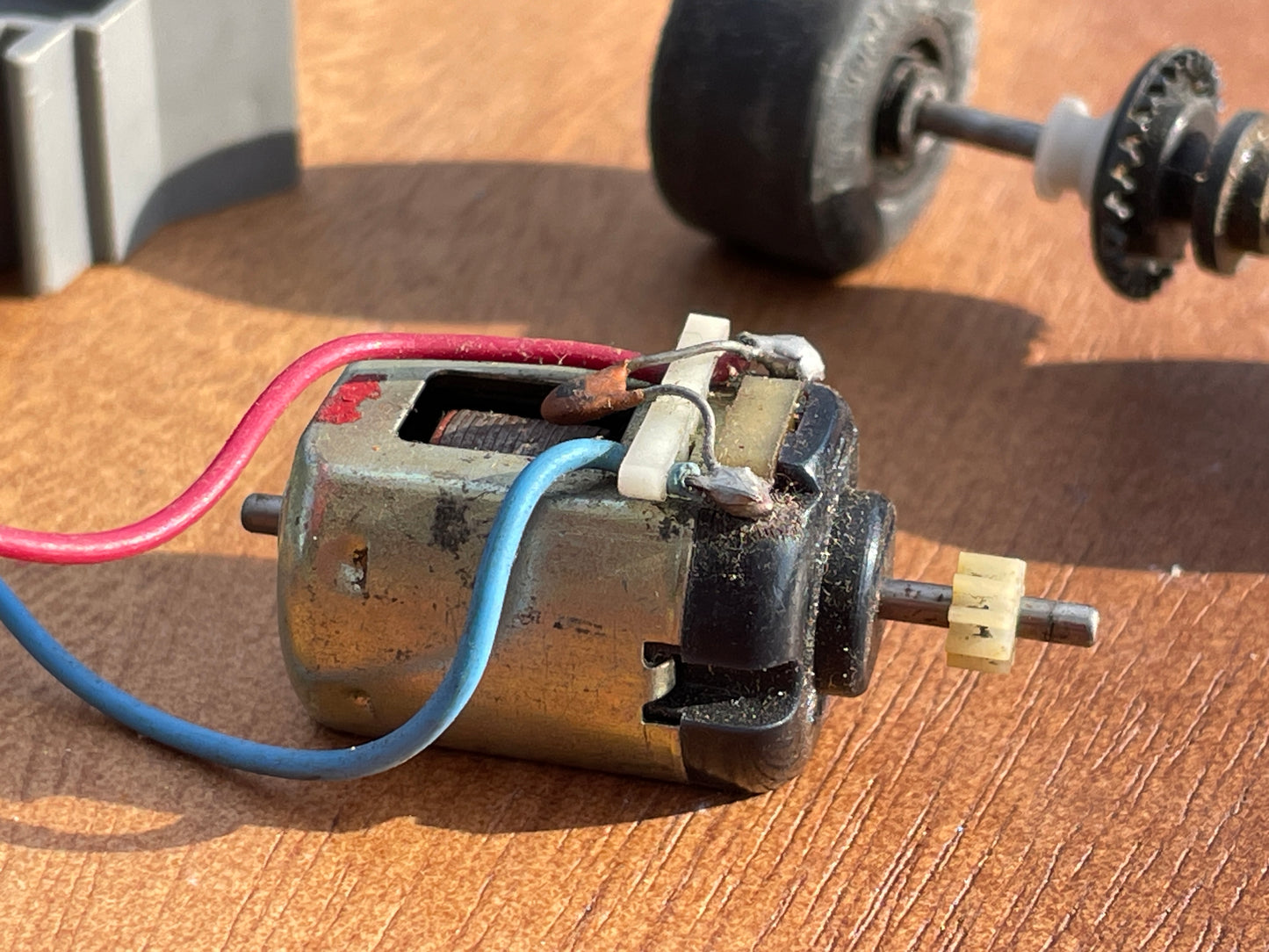 Original 70's Scalextric spares rear axil, motor and contact bushes, banked corner prop