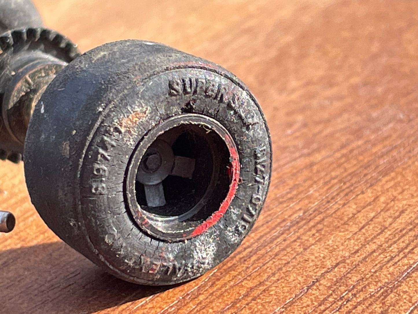 Original 70's Scalextric spares rear axil, motor and contact bushes, banked corner prop