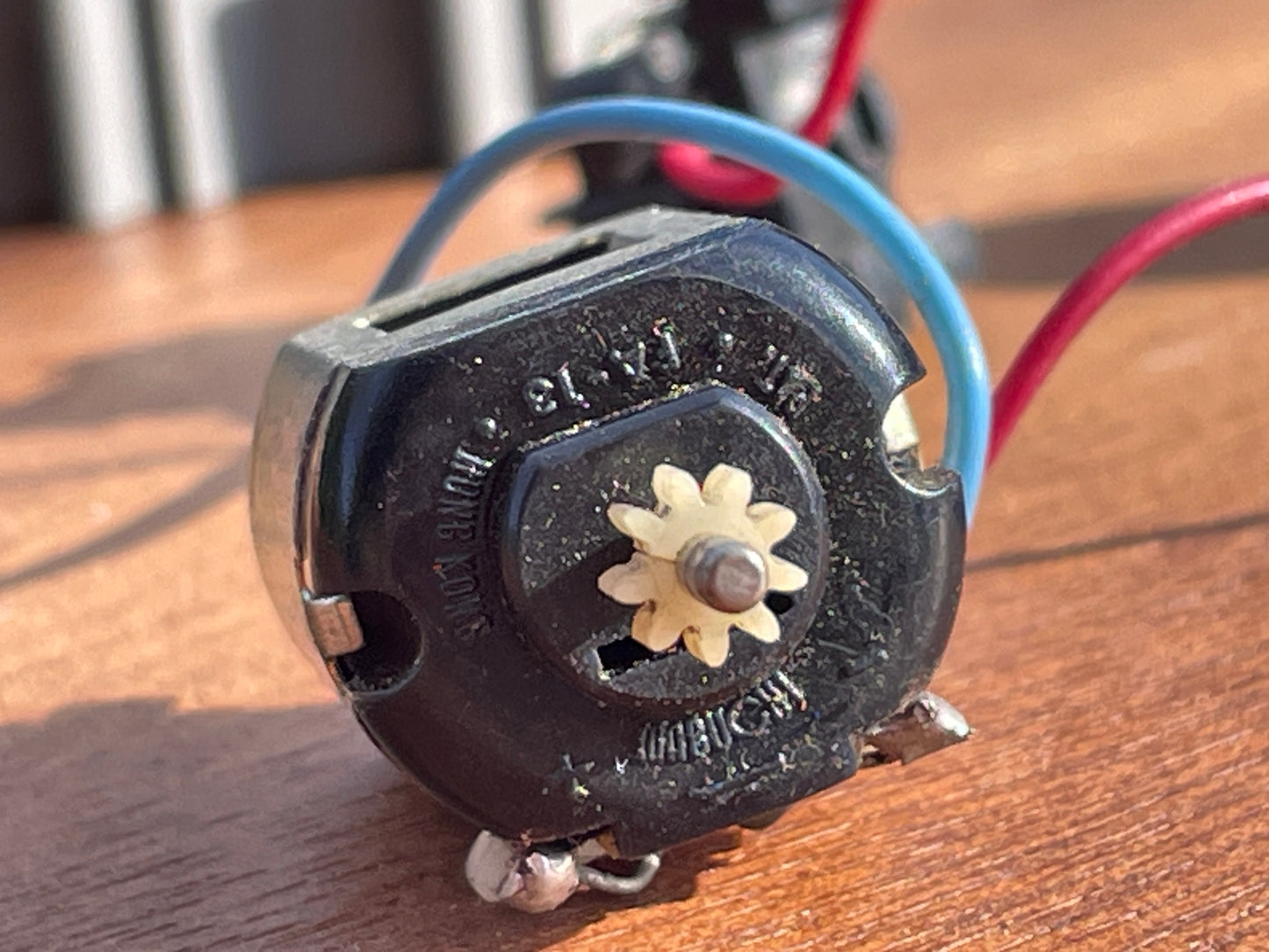 Original 70's Scalextric spares rear axil, motor and contact bushes, banked corner prop