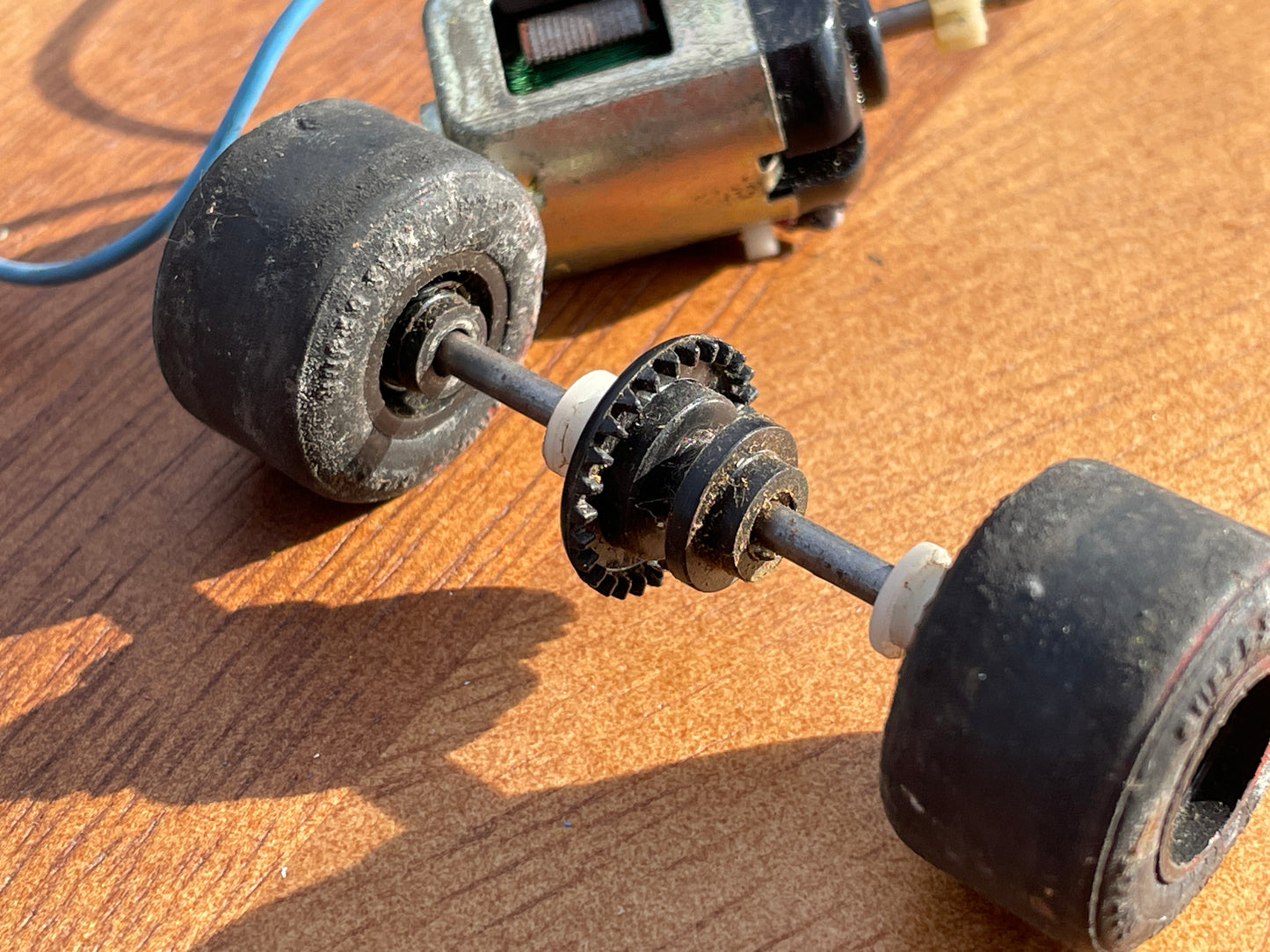 Original 70's Scalextric spares rear axil, motor and contact bushes, banked corner prop