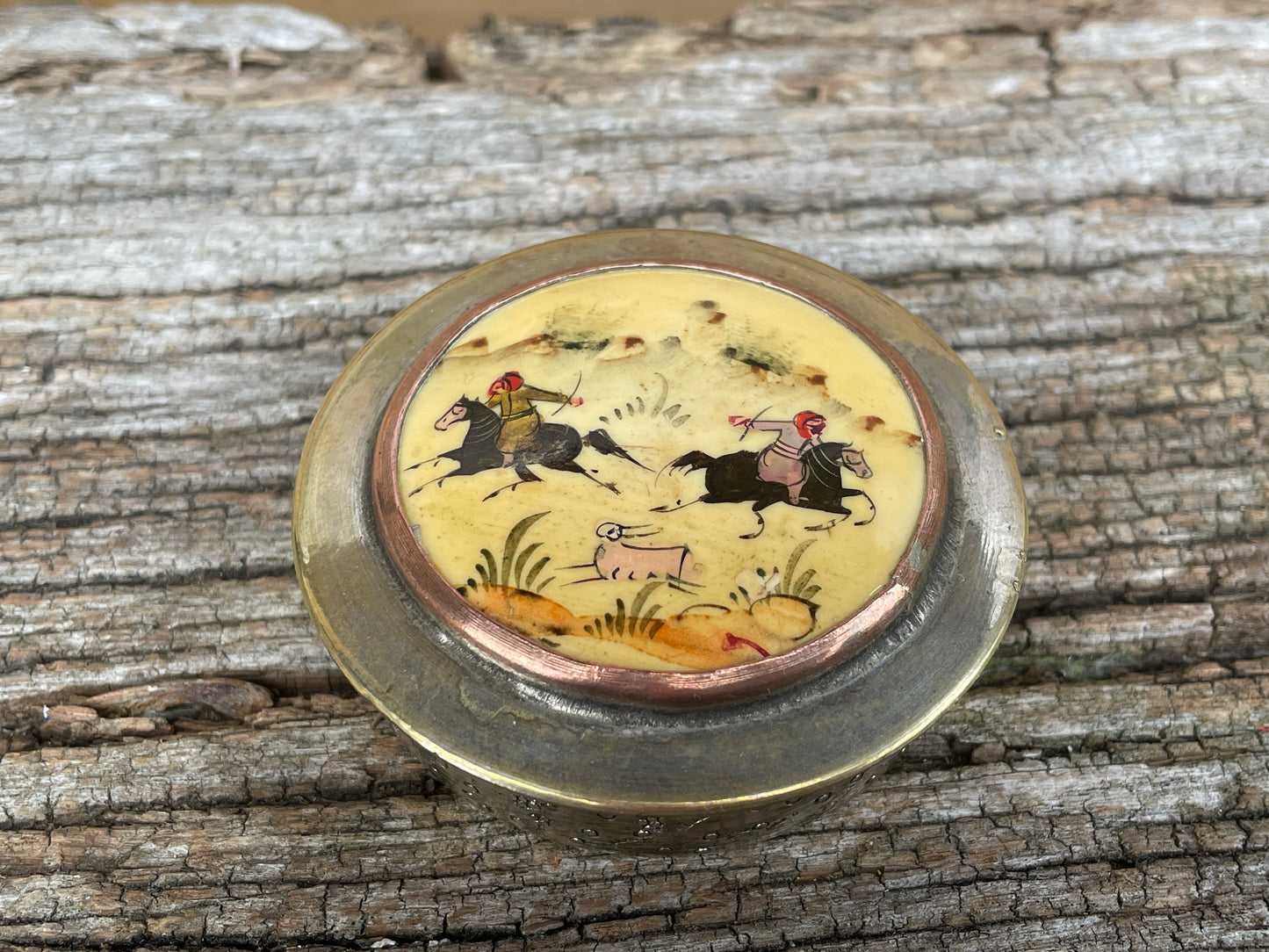 Vintage brass and ceramic powder box, pill box with Persian hunter riders chasing their game, hand painted
