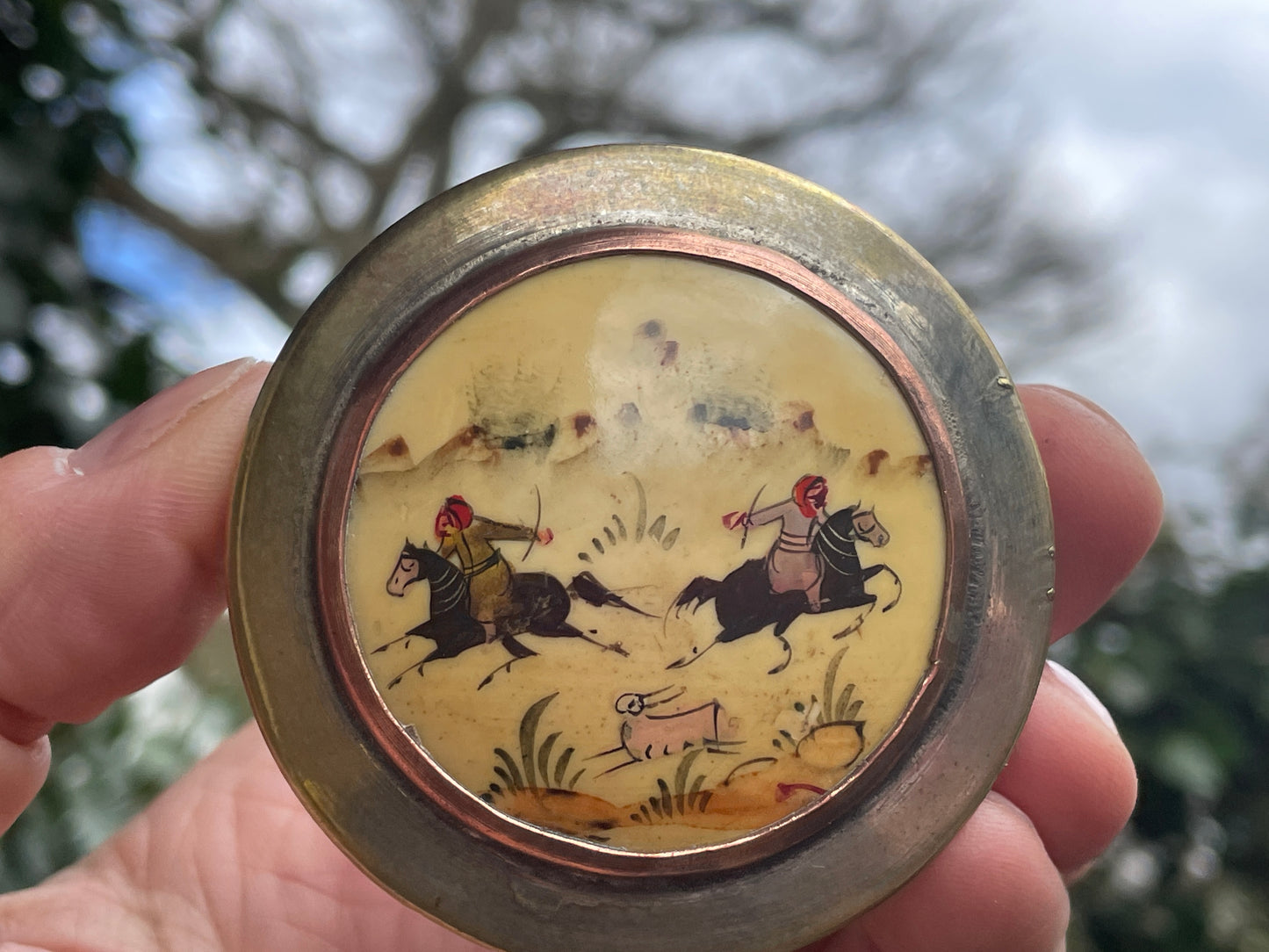 Vintage brass and ceramic powder box, pill box with Persian hunter riders chasing their game, hand painted