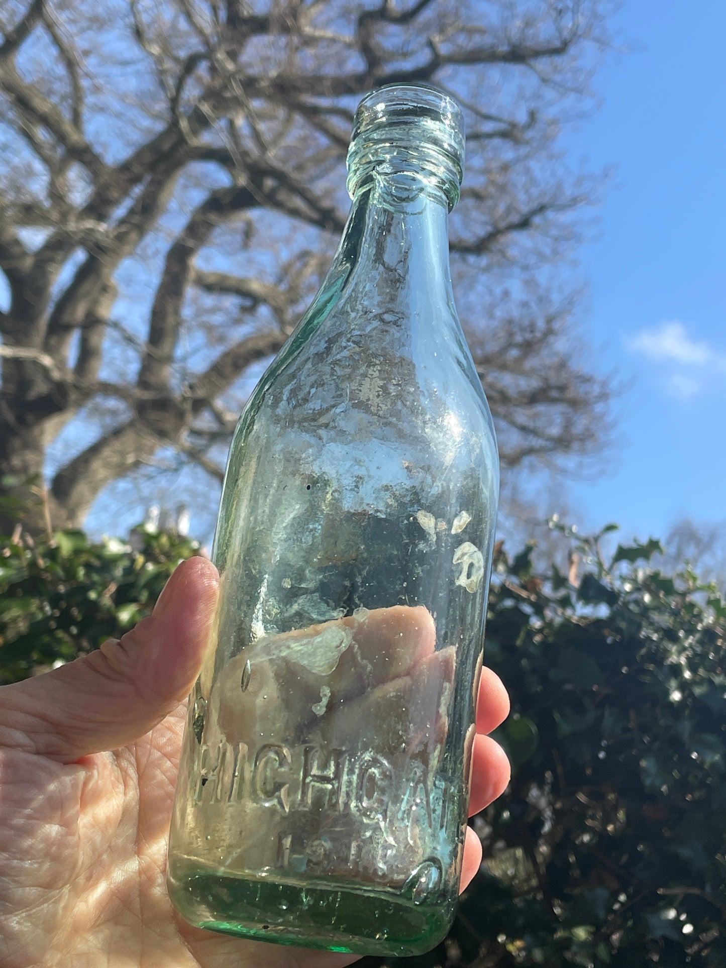 Two Highgate Brewery clear glass bottles incl. 1919 First World War Peace Celebration bottle