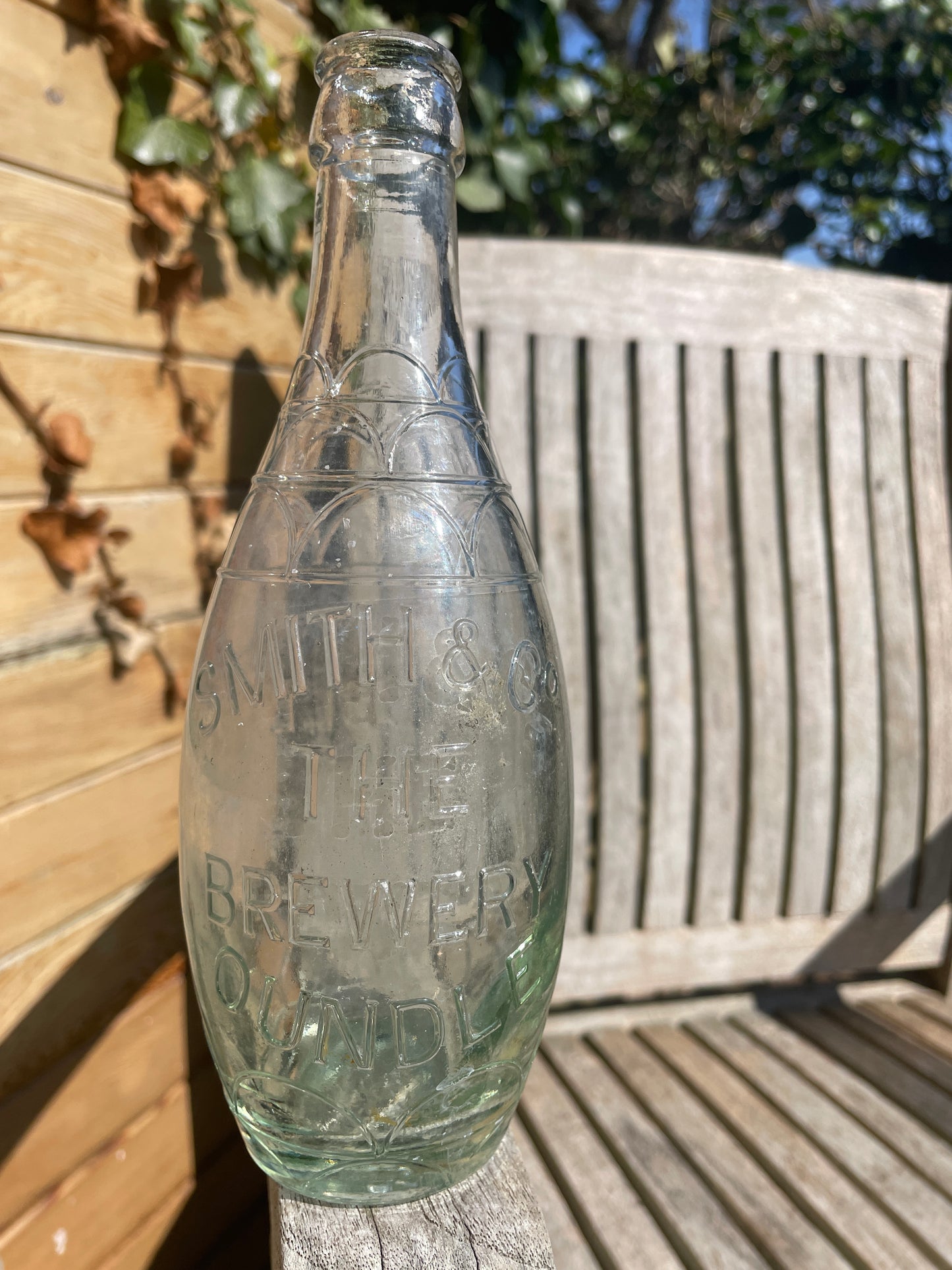 Original decorative Smith and Co. The Brewery Oundle torpedo shaped clear glass bottle 1938