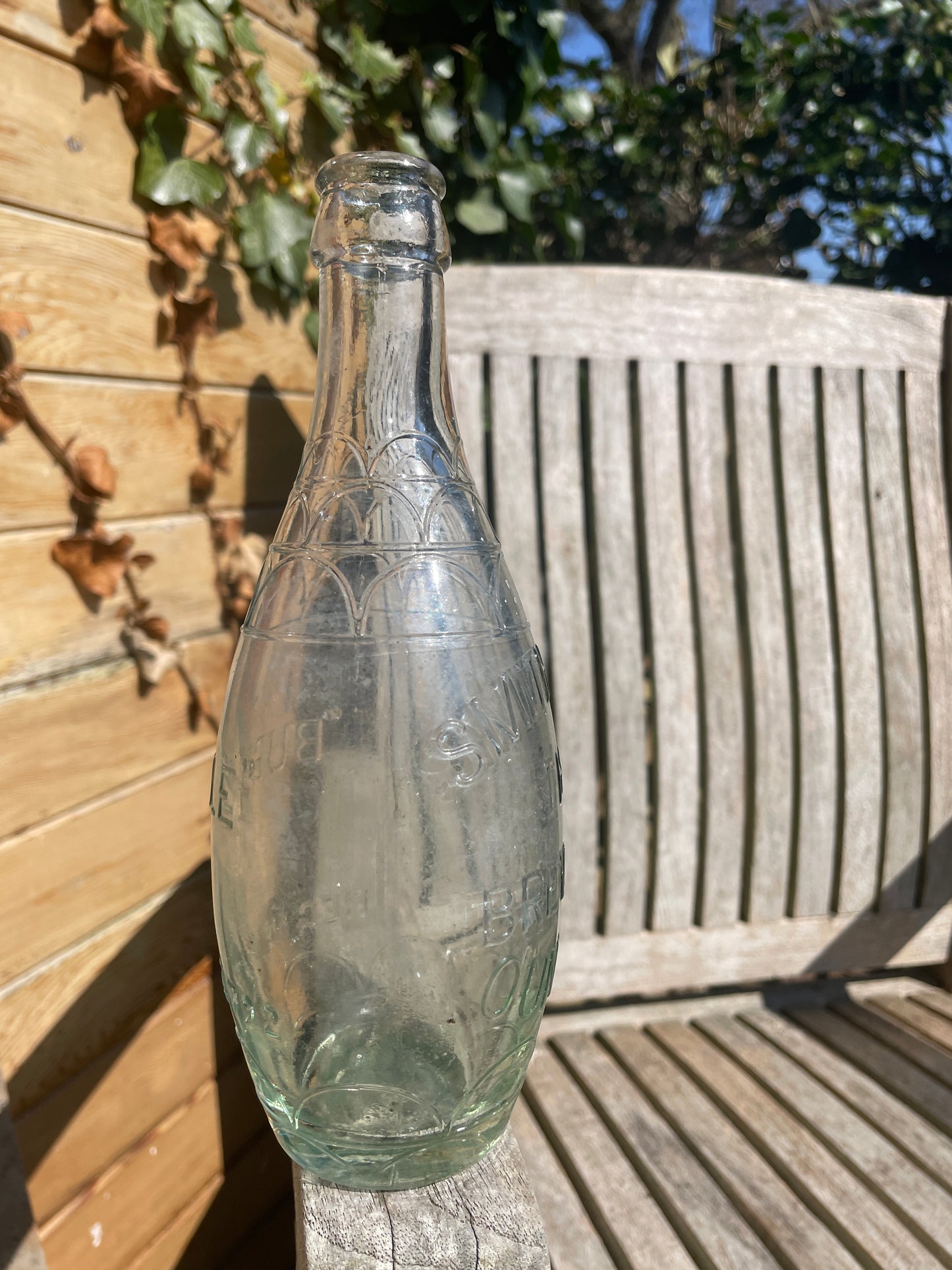 Original decorative Smith and Co. The Brewery Oundle torpedo shaped clear glass bottle 1938