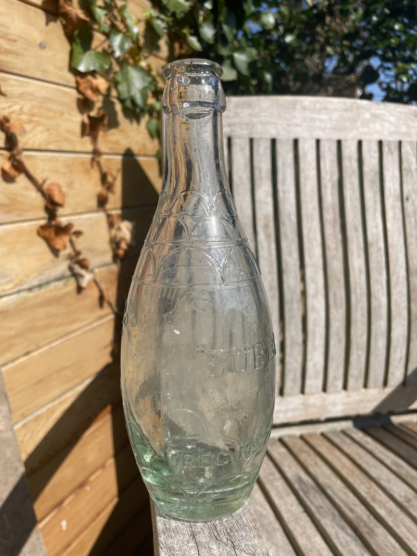 Original decorative Smith and Co. The Brewery Oundle torpedo shaped clear glass bottle 1938