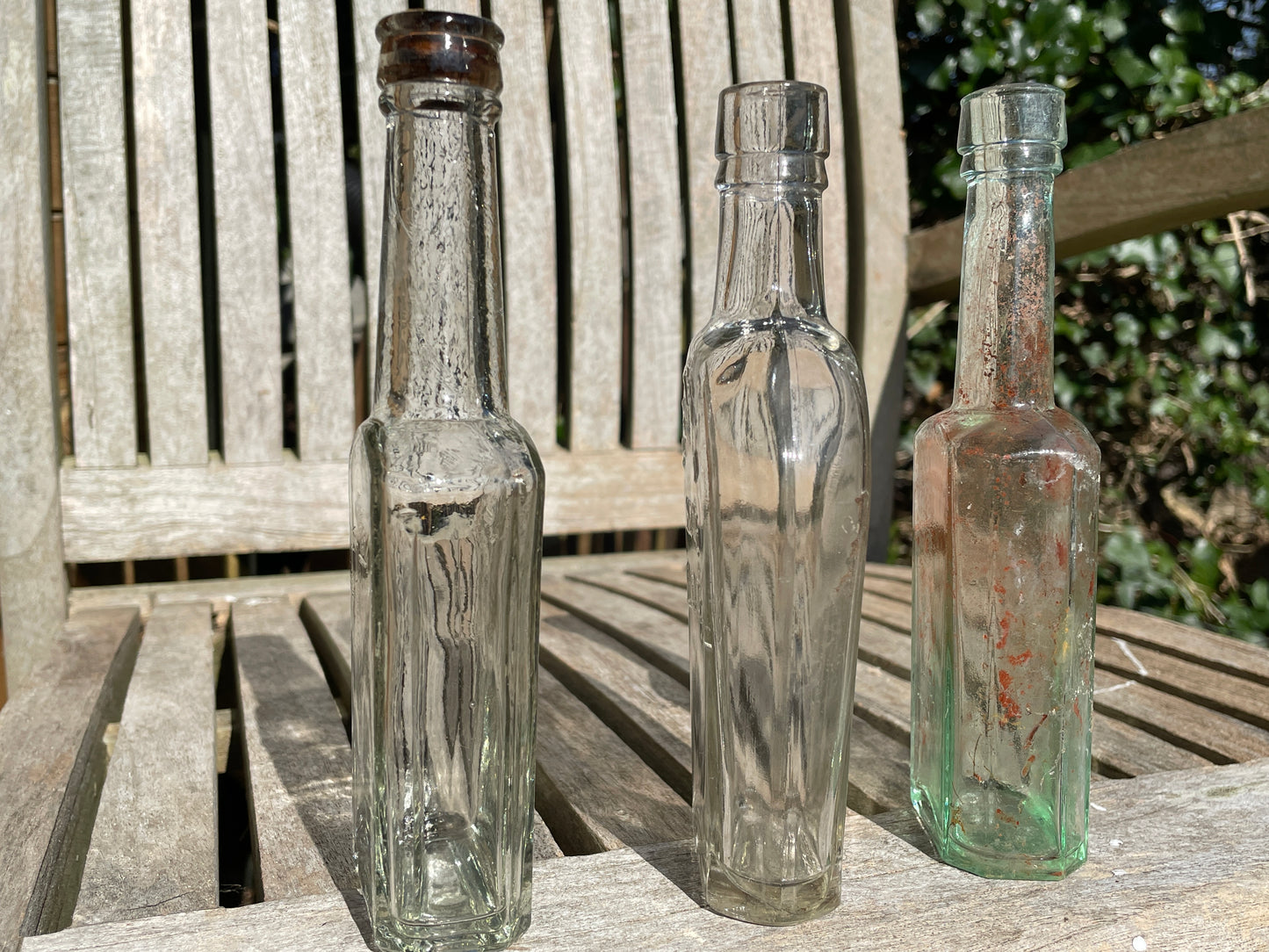 Yates's Wine Lodge and two other long necked antique bottles