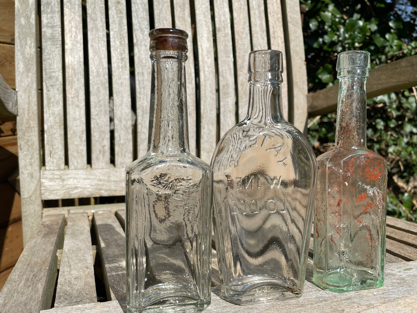 Yates's Wine Lodge and two other long necked antique bottles