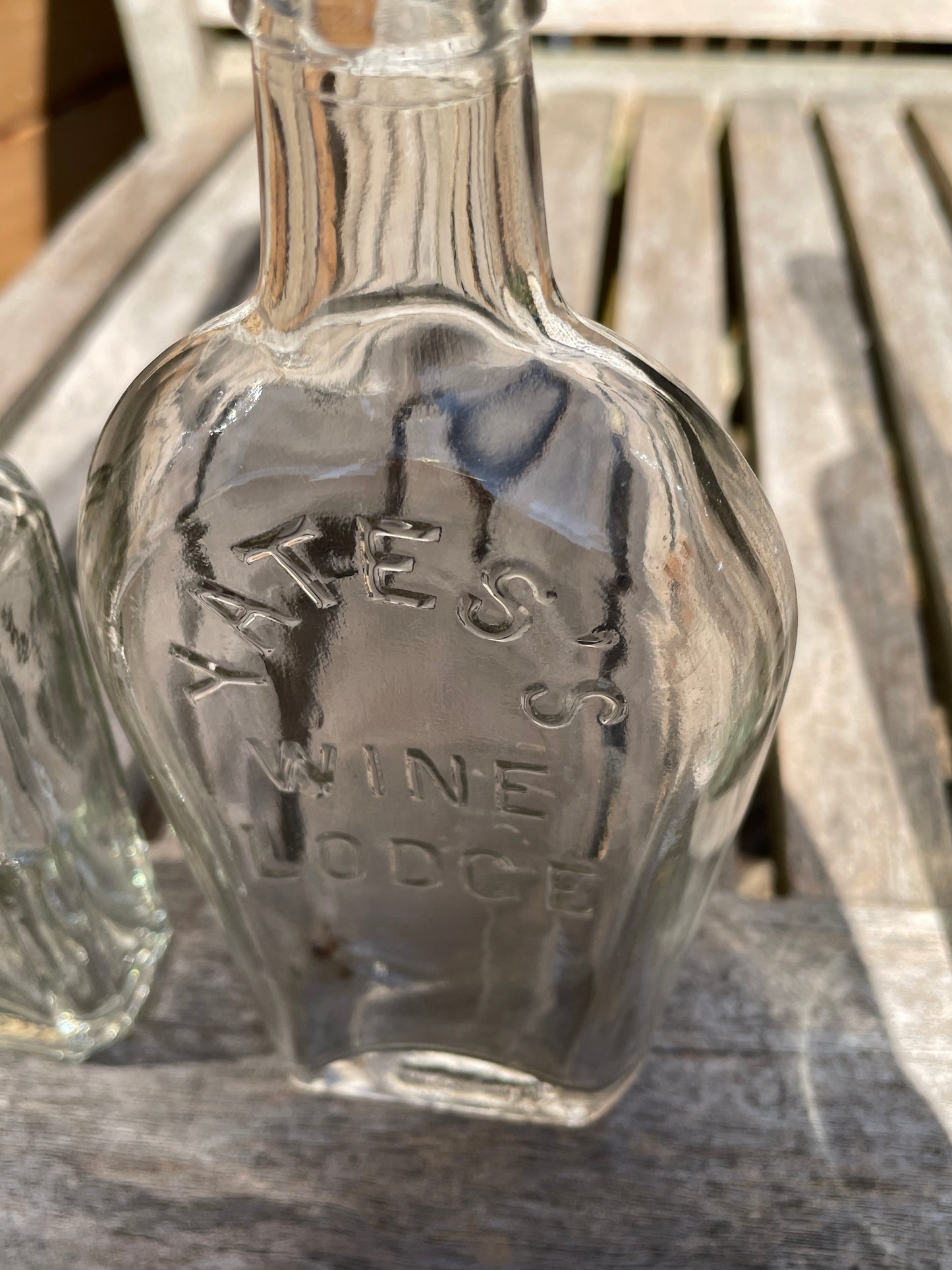 Yates's Wine Lodge and two other long necked antique bottles