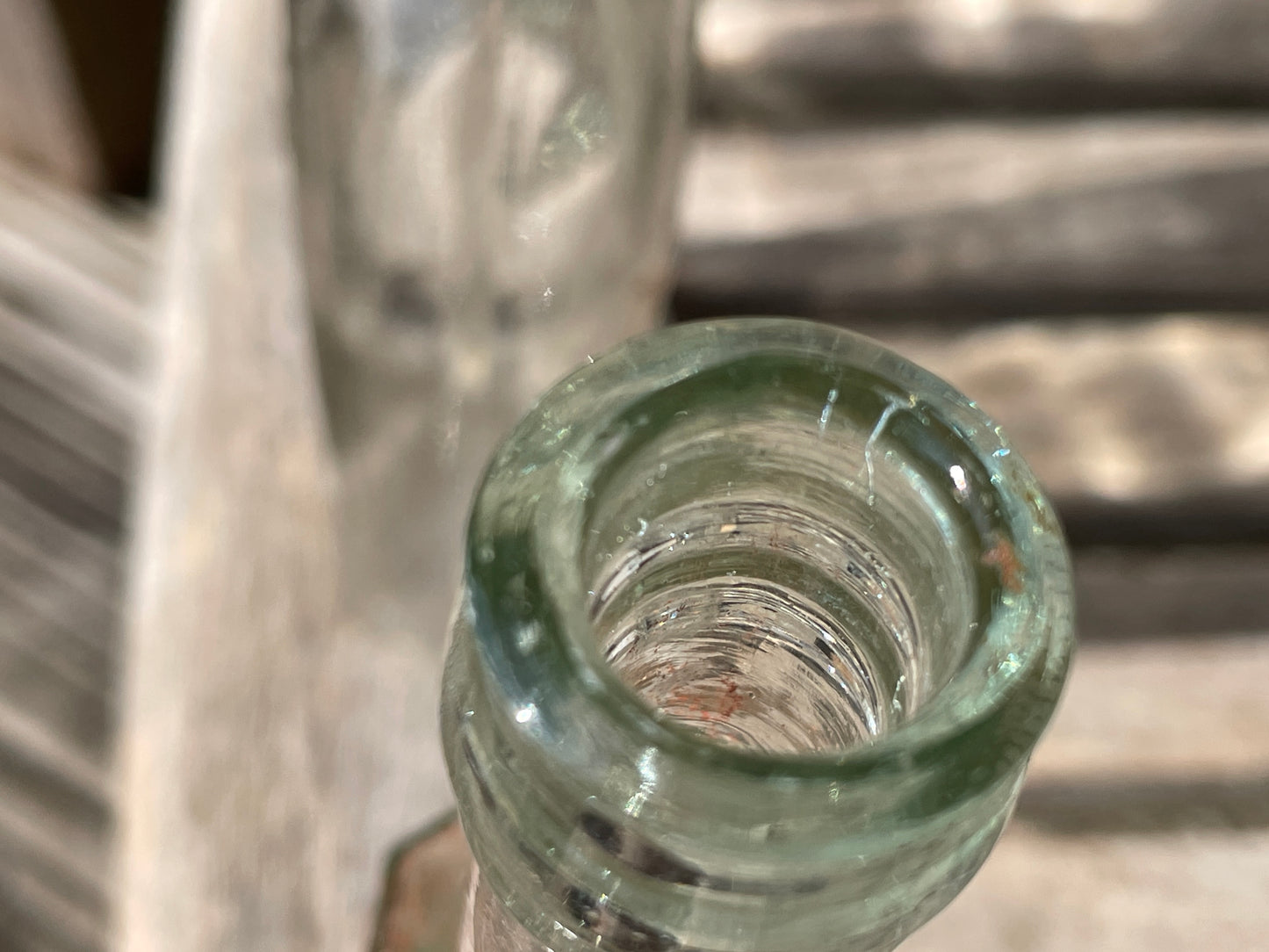 Yates's Wine Lodge and two other long necked antique bottles