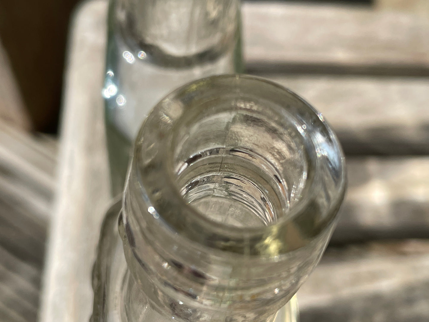 Yates's Wine Lodge and two other long necked antique bottles