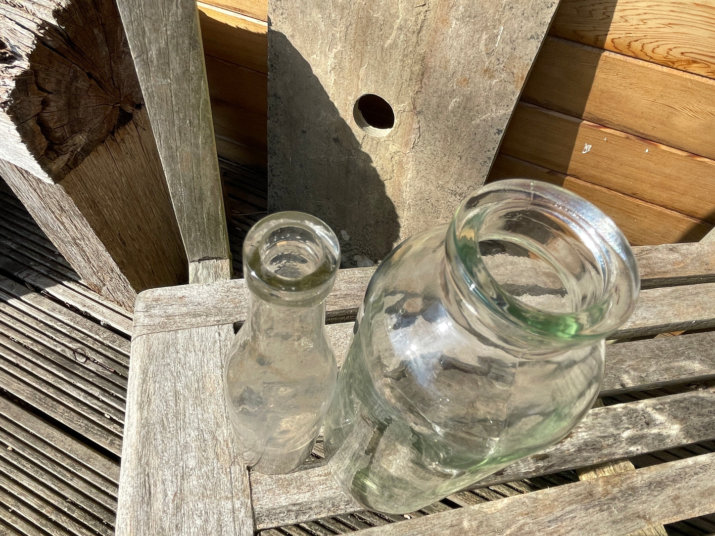 Four vintage clear glass bottles Tallest 19cm