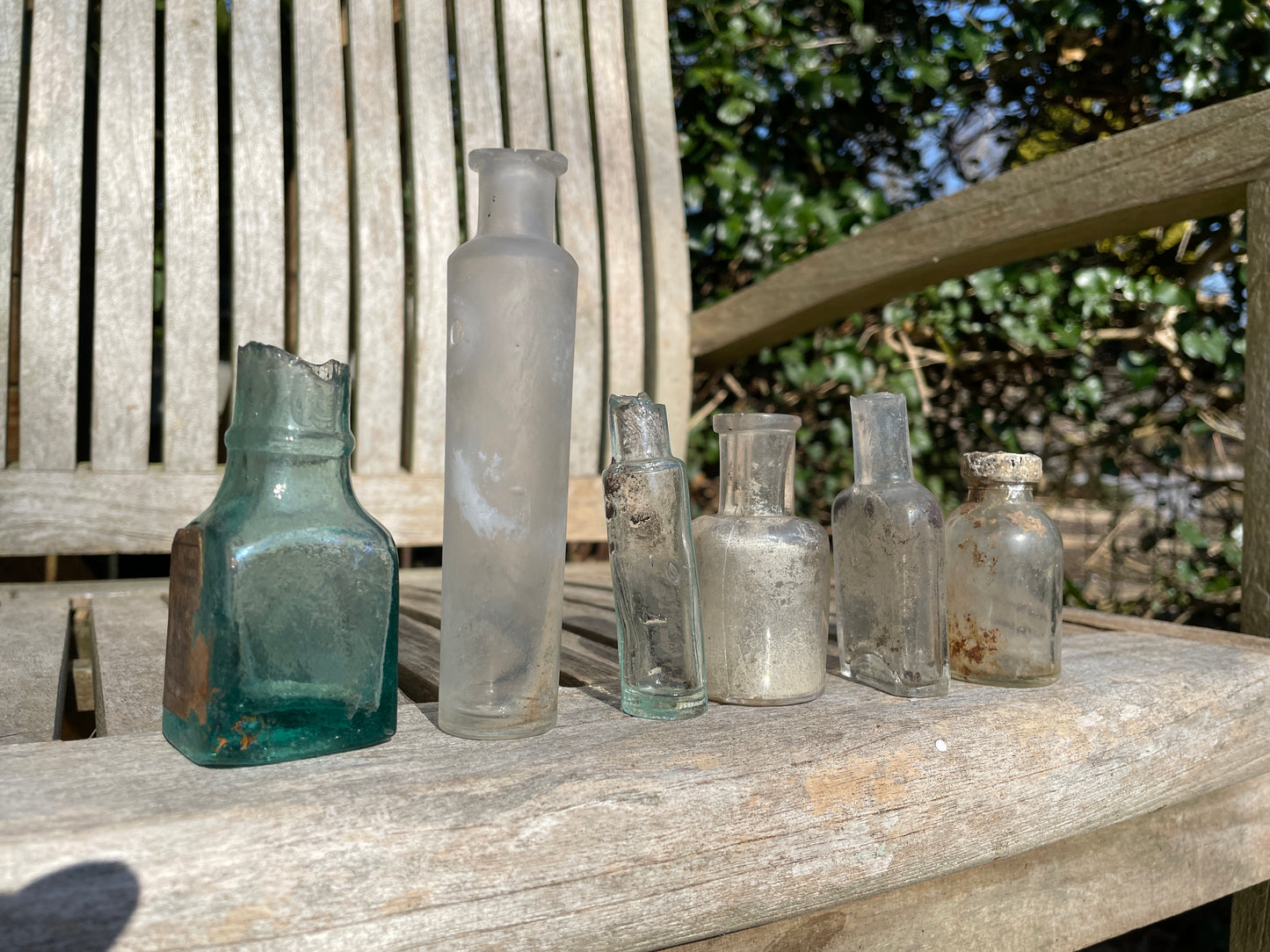six  19th century glass bottles including Liquid gum Wolverhampton Reade Brothers and American examples
