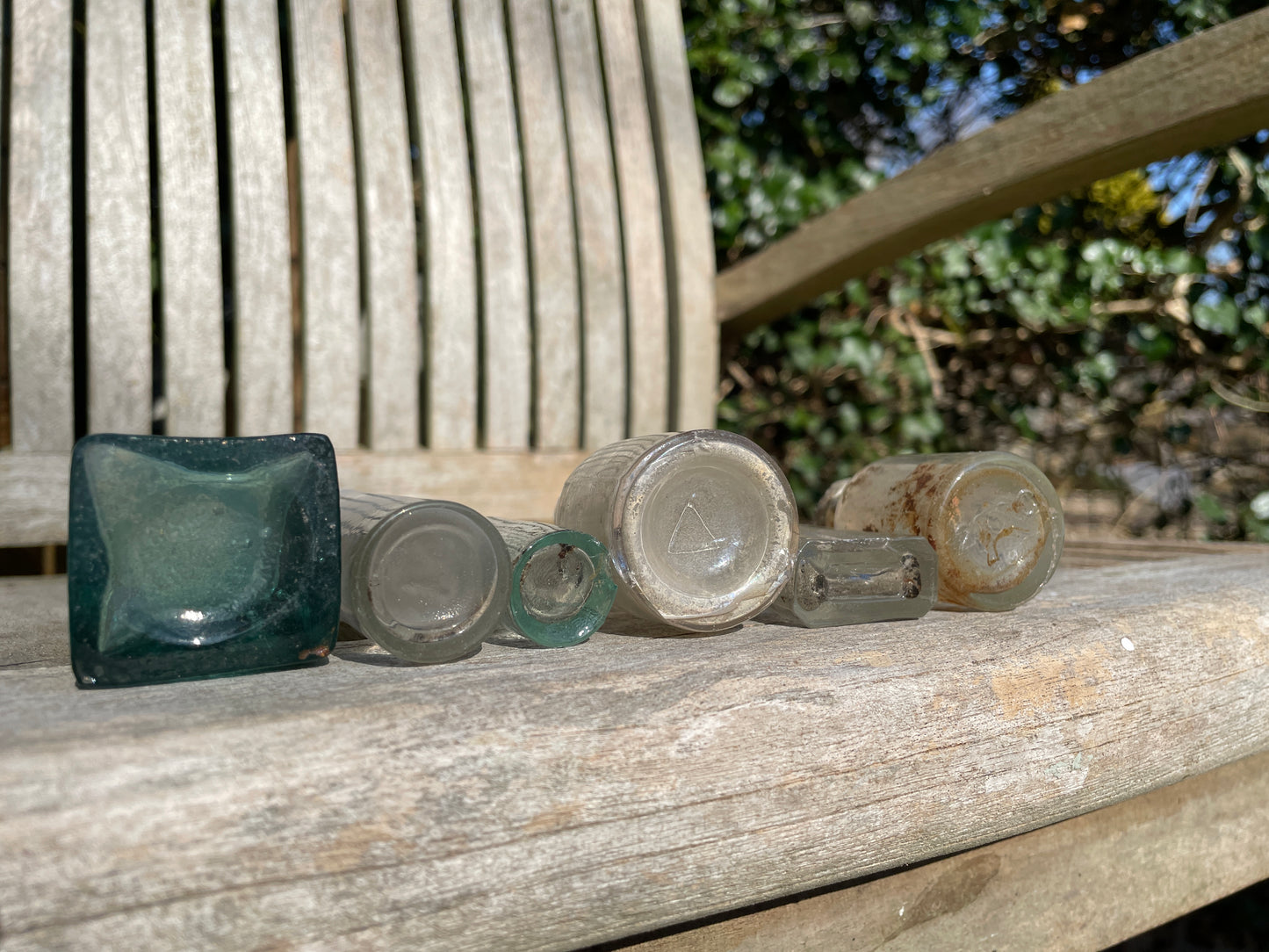 six  19th century glass bottles including Liquid gum Wolverhampton Reade Brothers and American examples