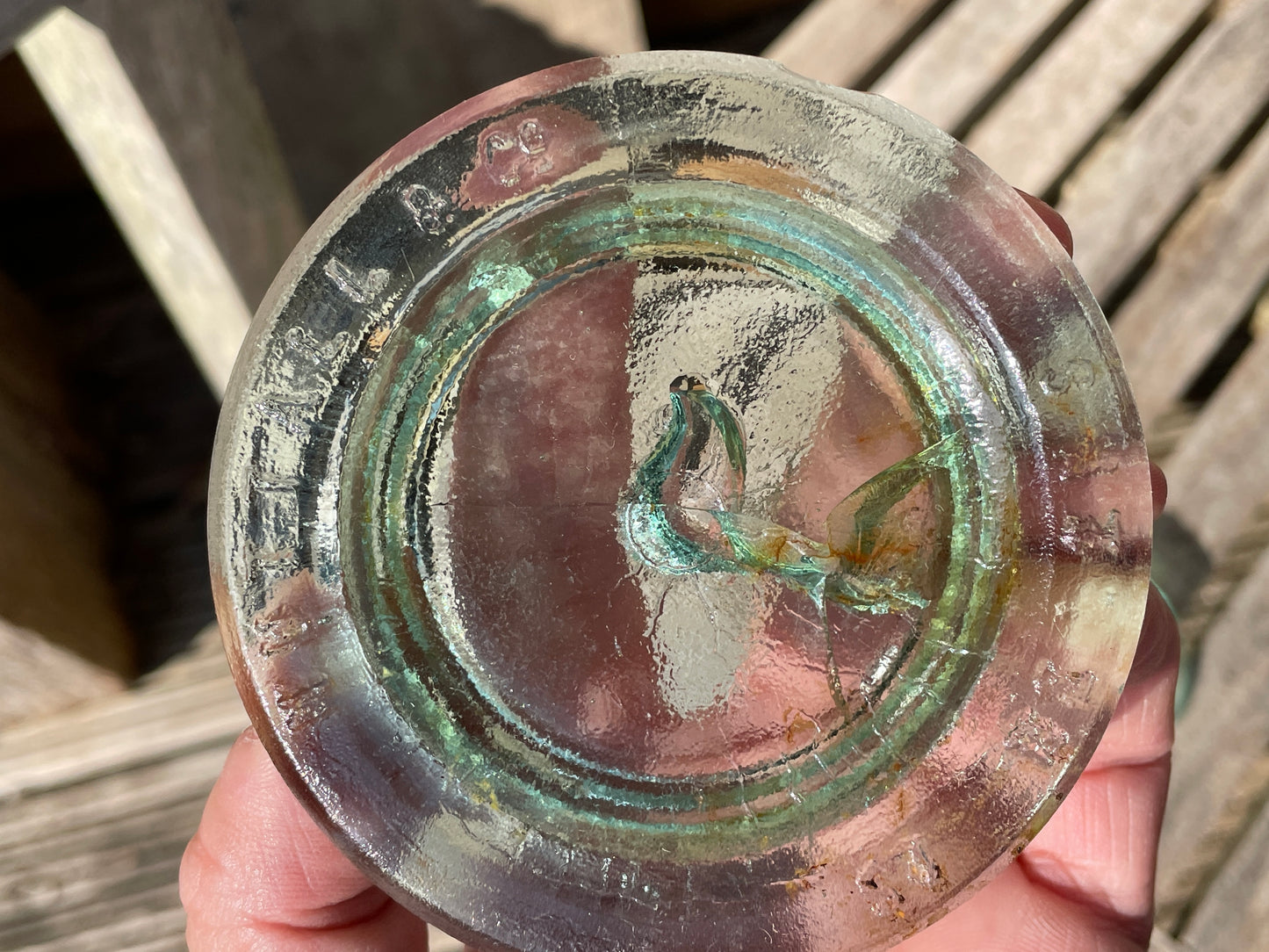 Two Nuttal and Co. St Helens glass jar lid and one other c1890