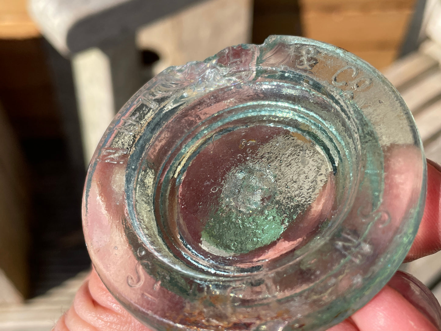 Two Nuttal and Co. St Helens glass jar lid and one other c1890