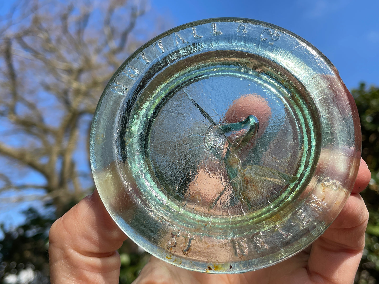 Two Nuttal and Co. St Helens glass jar lid and one other c1890
