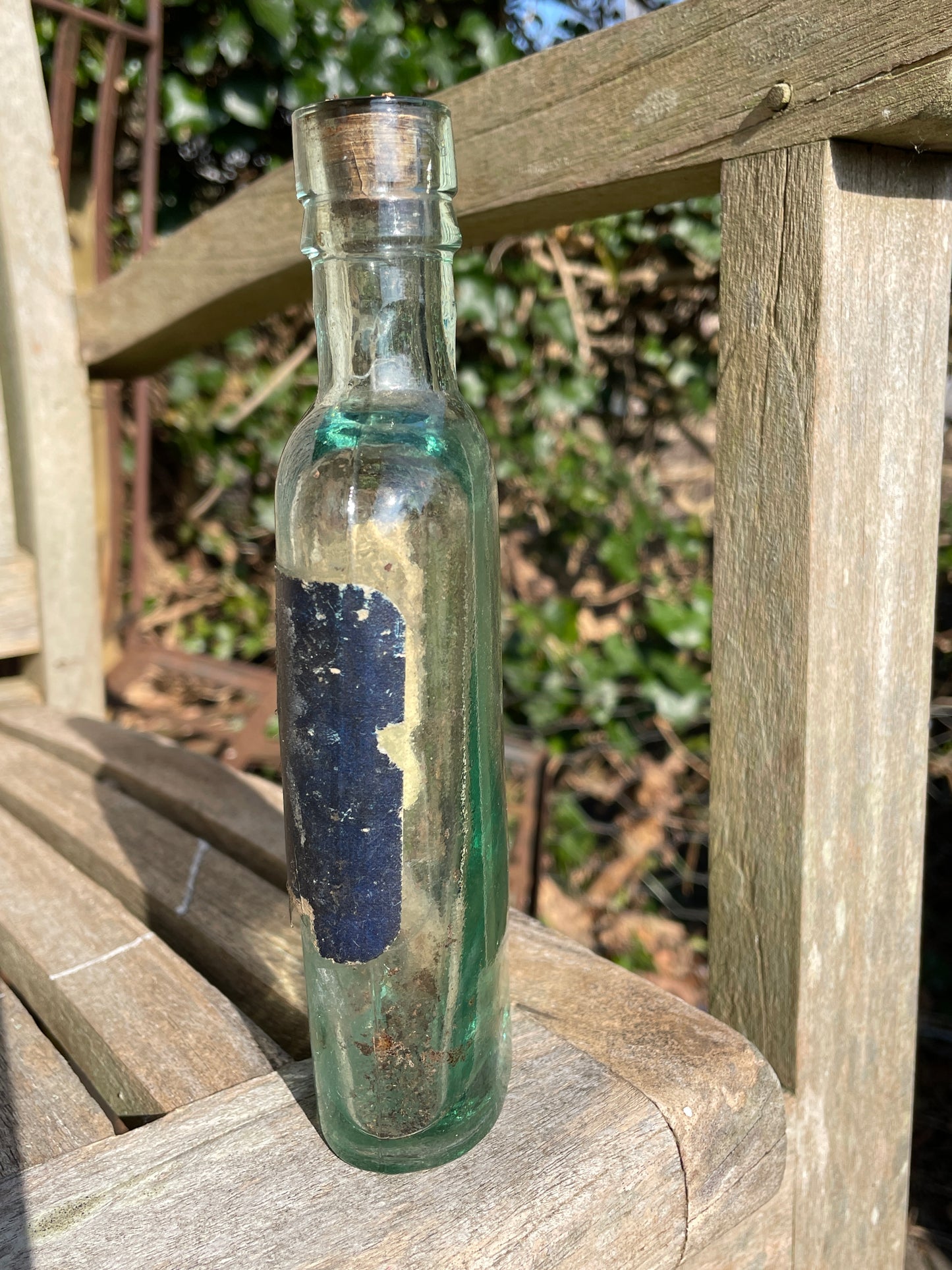 Victorian bottle with original label and cork embossed S&R to base