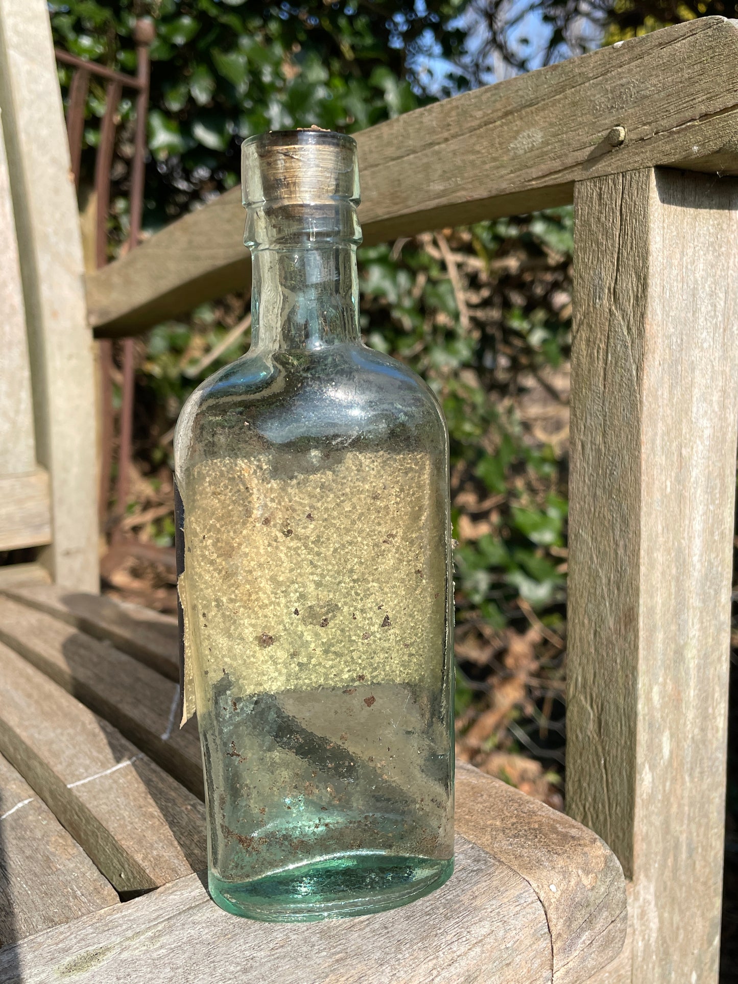 Victorian bottle with original label and cork embossed S&R to base
