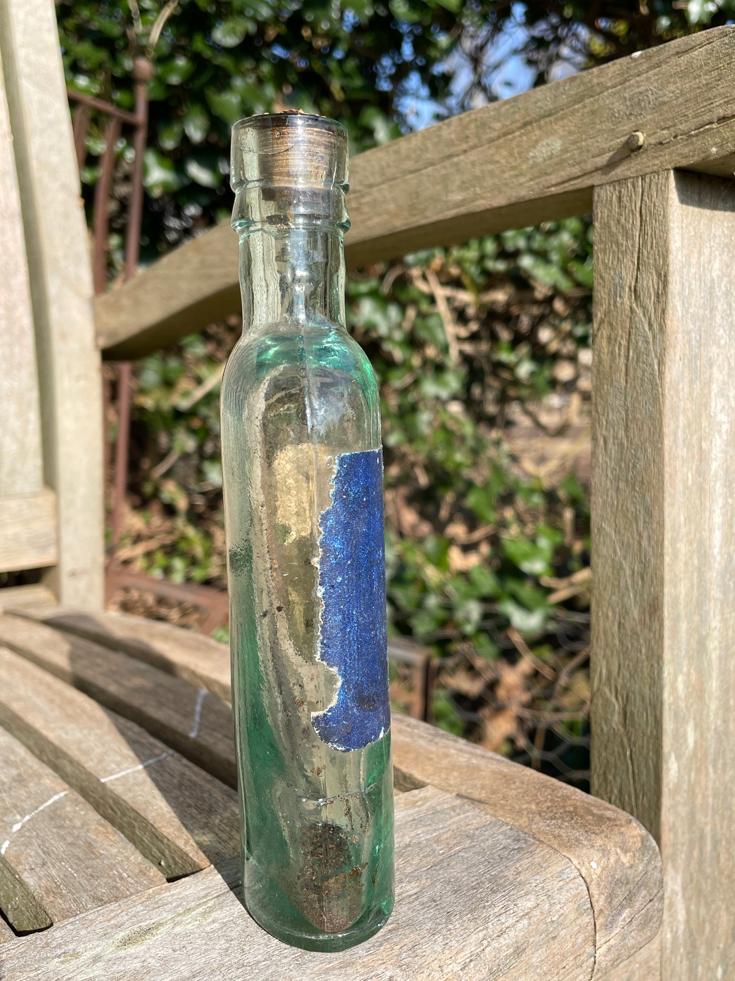 Victorian bottle with original label and cork embossed S&R to base