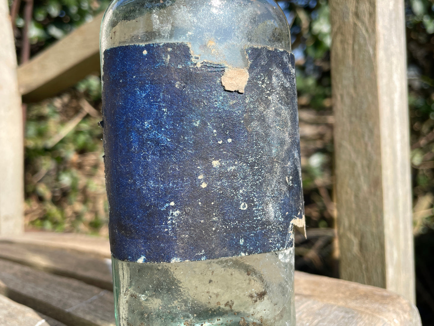 Victorian bottle with original label and cork embossed S&R to base