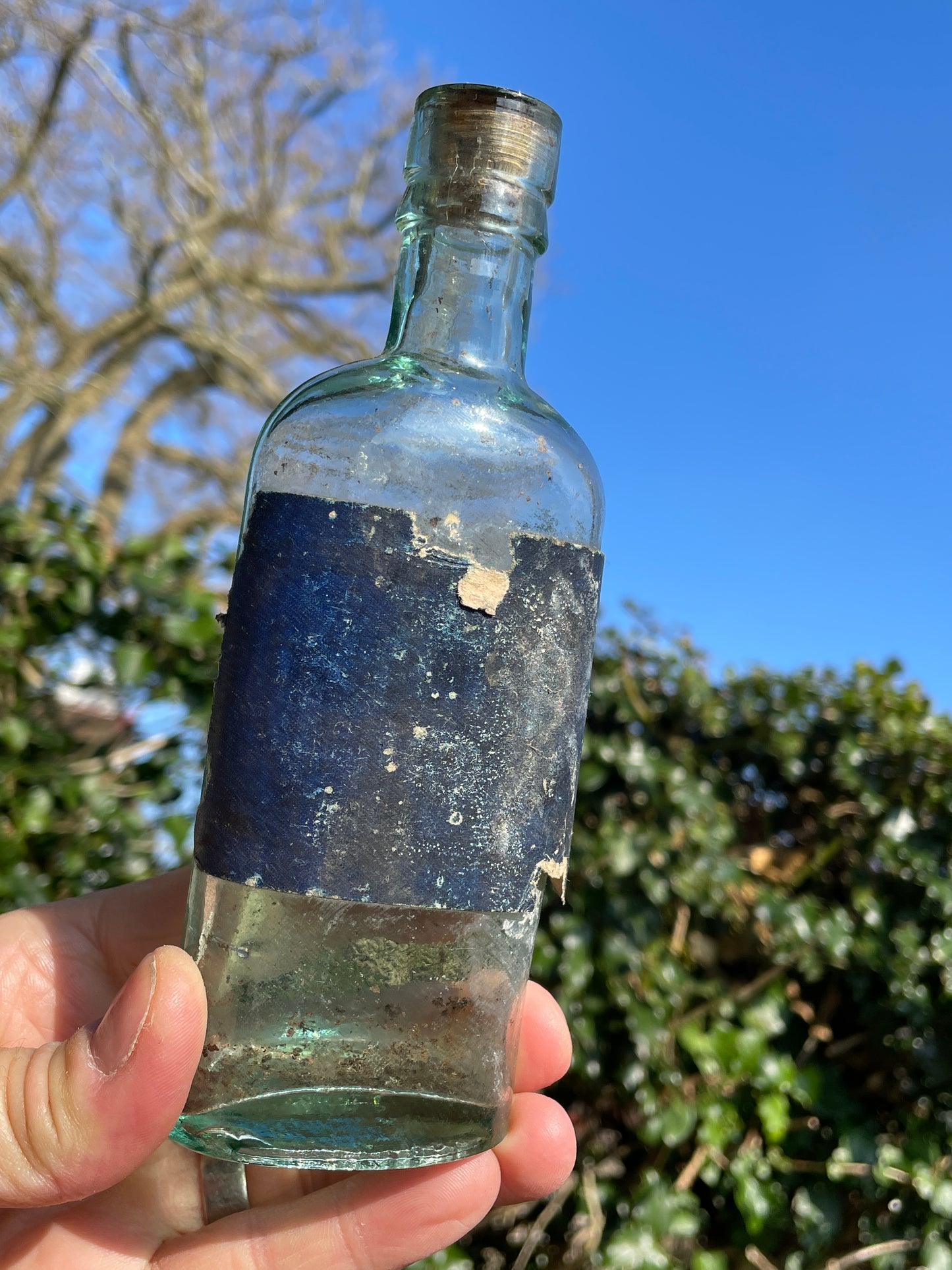 Victorian bottle with original label and cork embossed S&R to base