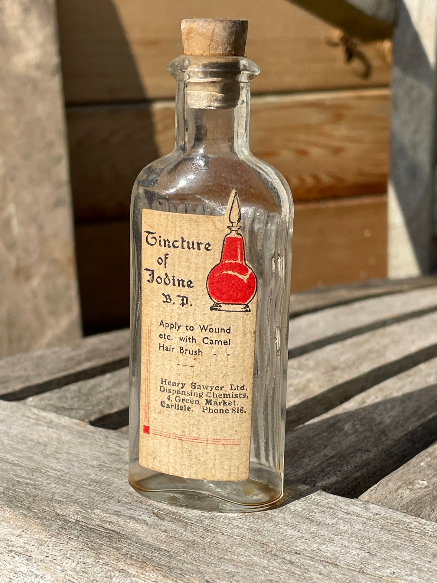 Antique Victorian bottle with original label and cork stopper 11cm tall